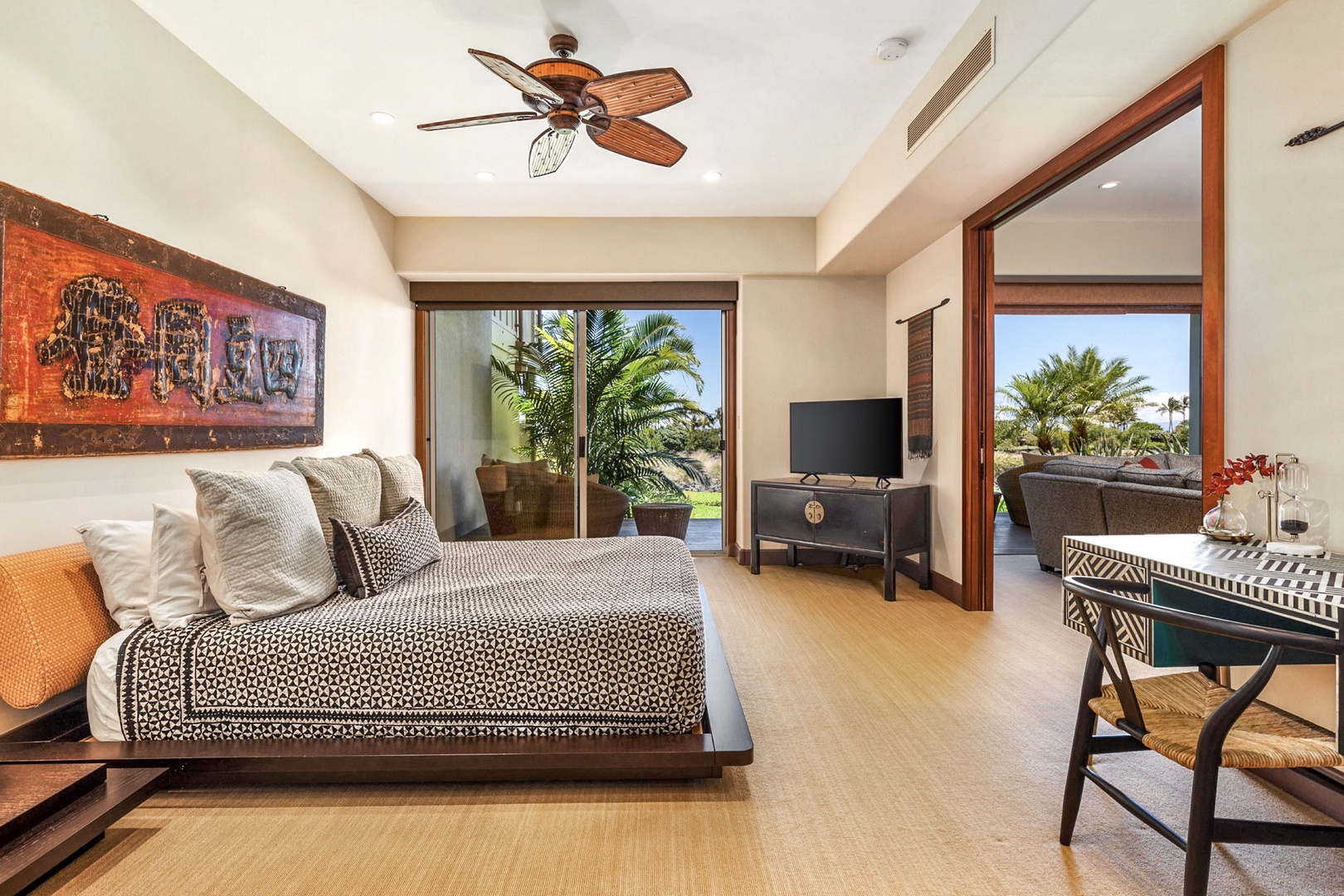 Kailua Kona Vacation Rentals, 3BD Ka'Ulu Villa (131C) at Four Seasons Resort at Hualalai - Downstairs primary bedroom suite with private deck, flat screen TV, sliding doors to bonus retreat room, and en-suite bath.