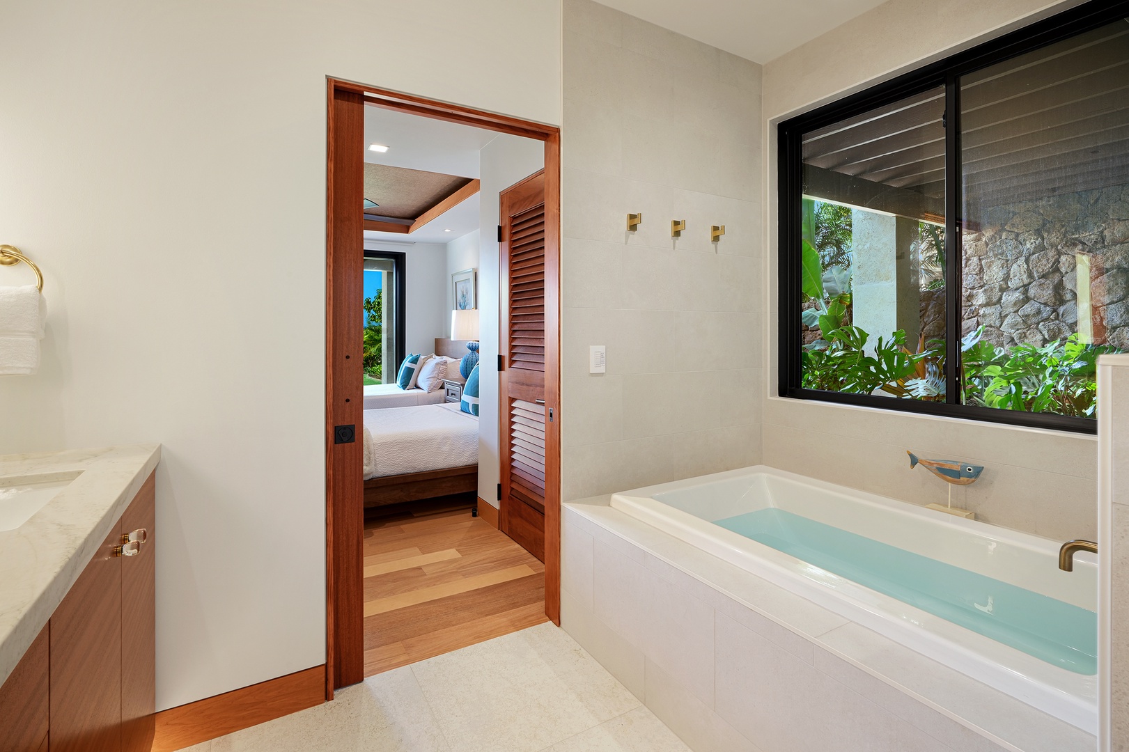 Koloa Vacation Rentals, Hale Kai'Opua - Relaxing bathroom featuring a deep soaking tub with a private garden view.