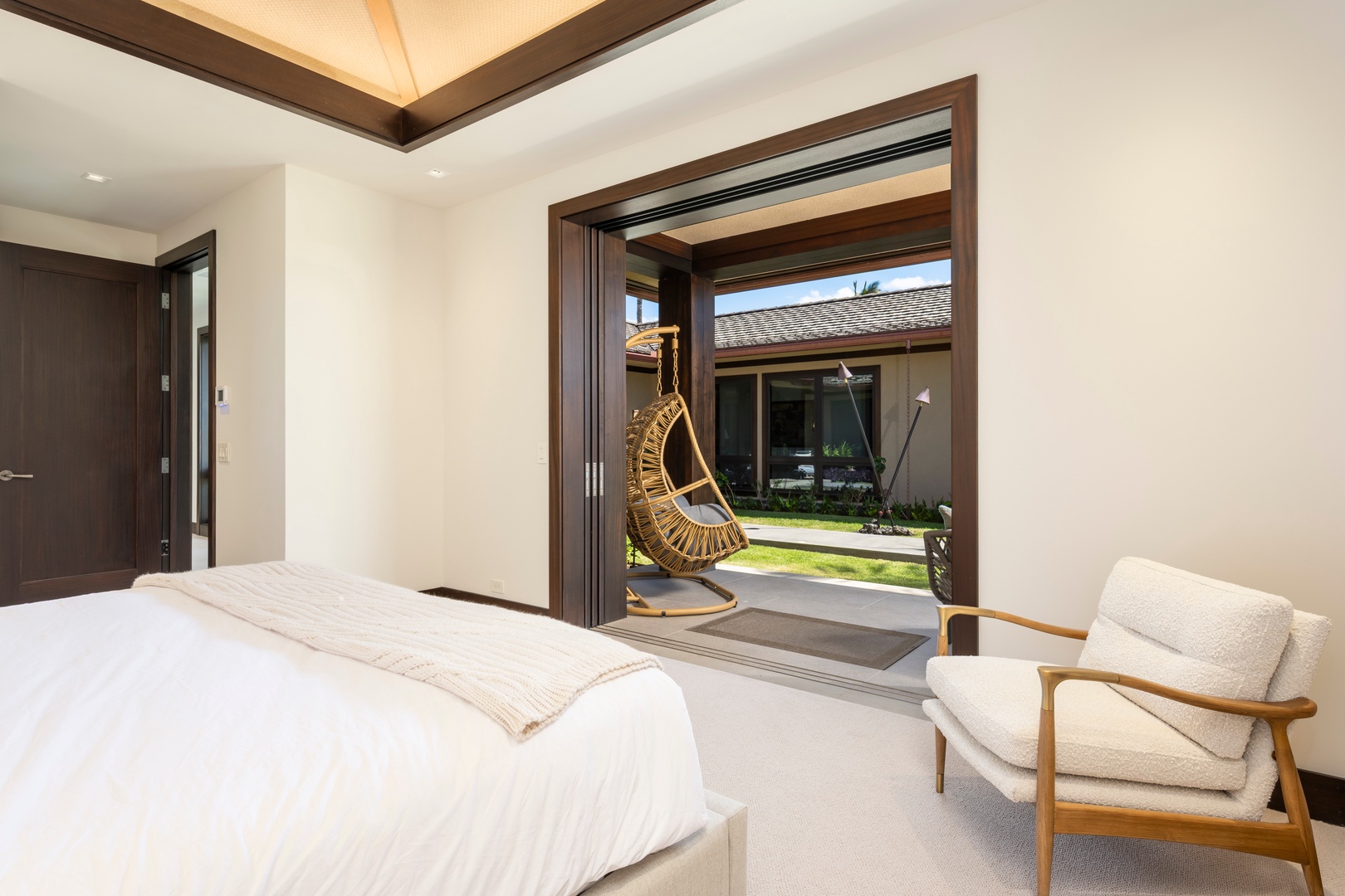 Kailua-Kona Vacation Rentals, 4BD Ka'Ulu Estate (102A) at Hualalai Resort - Guest Bedroom #4: Wake up in your own peaceful sanctuary with cozy indoor and outdoor seating.