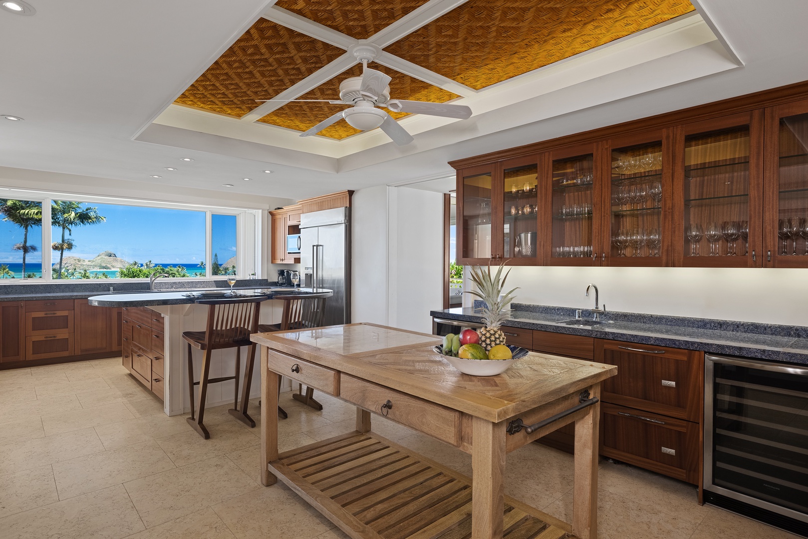 Kailua Vacation Rentals, Leaf House - The kitchen’s inviting design features an island, modern appliances, and ample storage, creating a perfect space for meal prep or casual gatherings.
