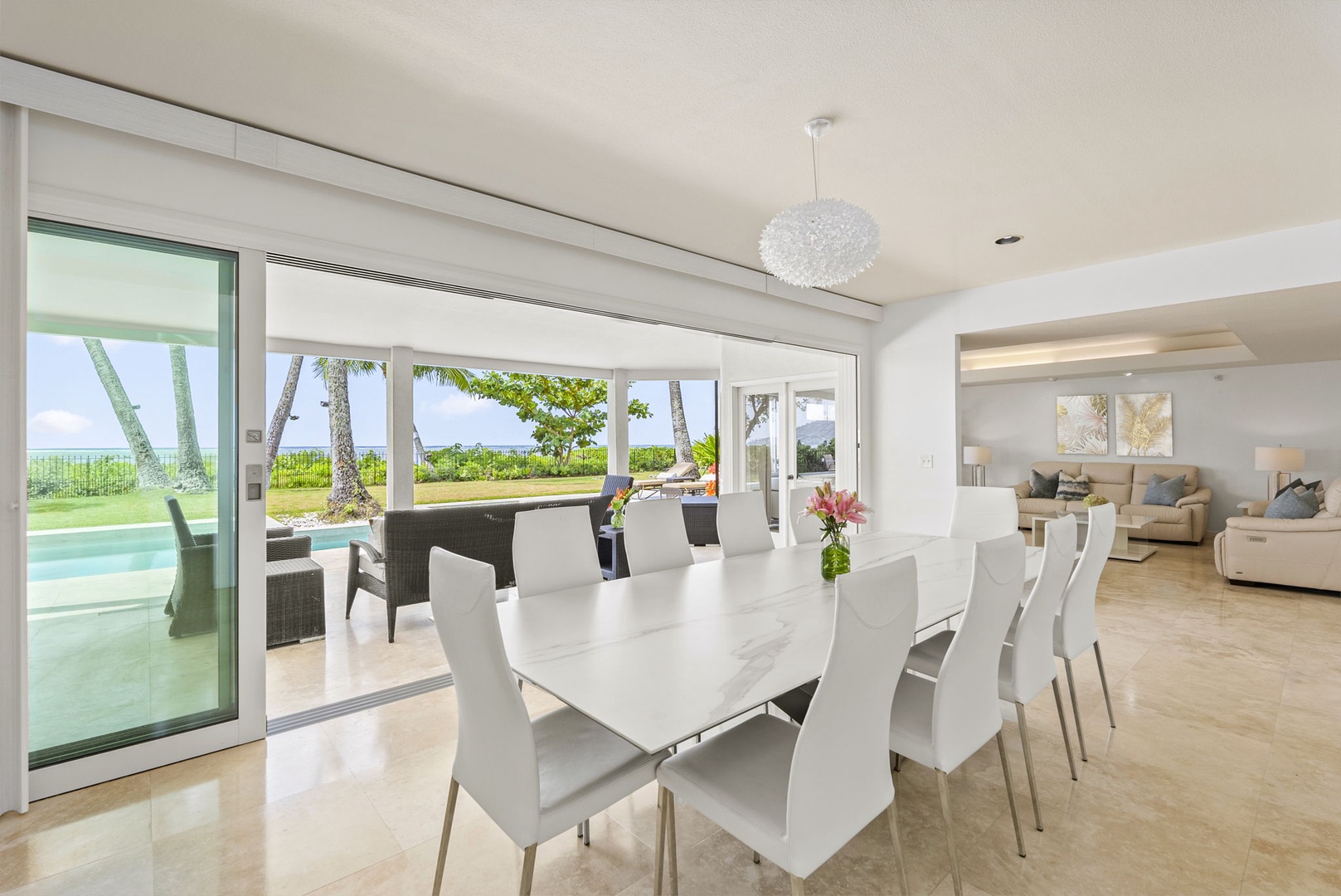 Honolulu Vacation Rentals, Paradise Beach Estate - Dine against the backdrop of the Pacific—this oceanfront dining room offers floor-to-ceiling glass and unobstructed coastal views.