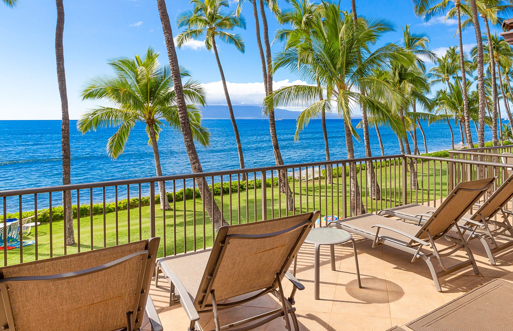 Lahaina Vacation Rentals, Puamana 240-3 - Unwind on the lanai with uninterrupted ocean views and the soothing sound of the waves.