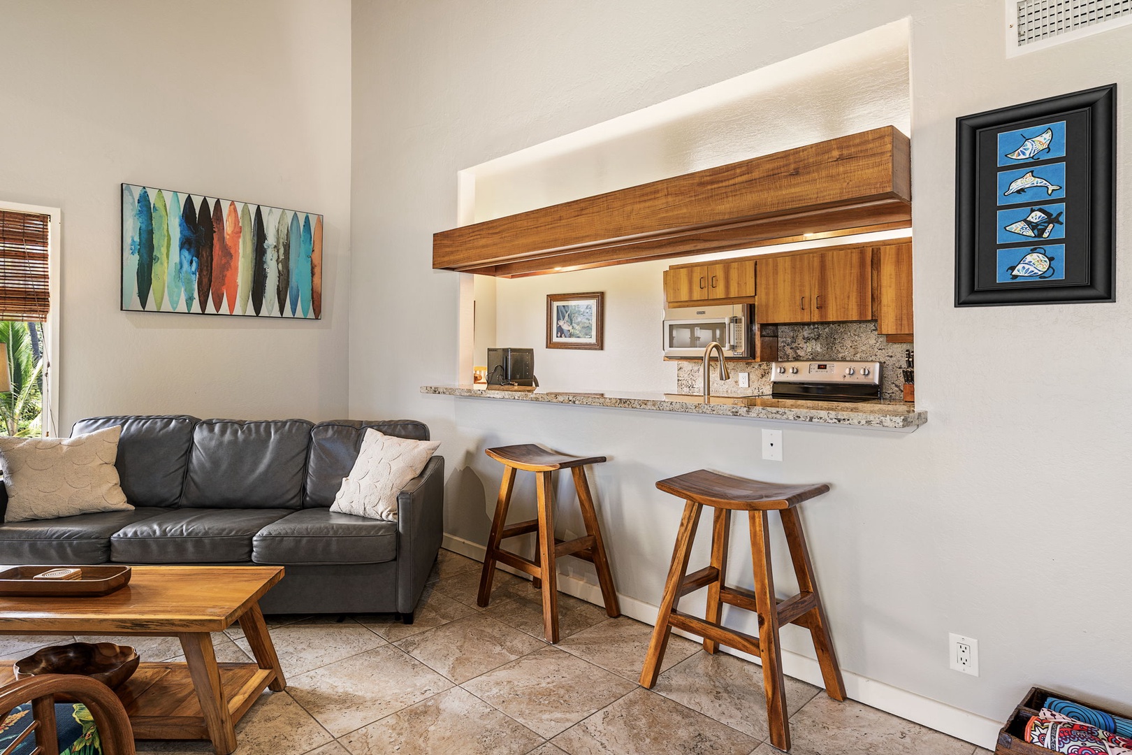 Kailua Kona Vacation Rentals, Kanaloa at Kona 1606 - Bar stools at the pass-through keep the cook in the conversation.