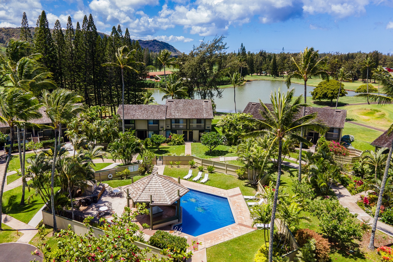 Kahuku Vacation Rentals, Pulelehua Kuilima Estates West #142 - Aerial shot of the community pool area.