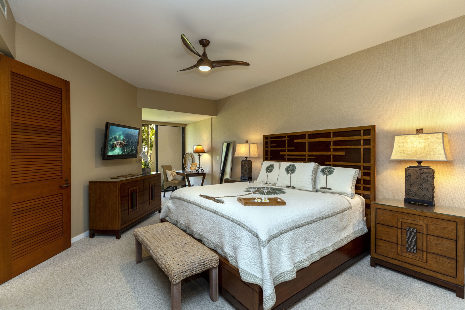 Kamuela Vacation Rentals, Mauna Lani Point E105 - Sleep soundly in the king-size bed with direct access to the lanai and peaceful garden views.