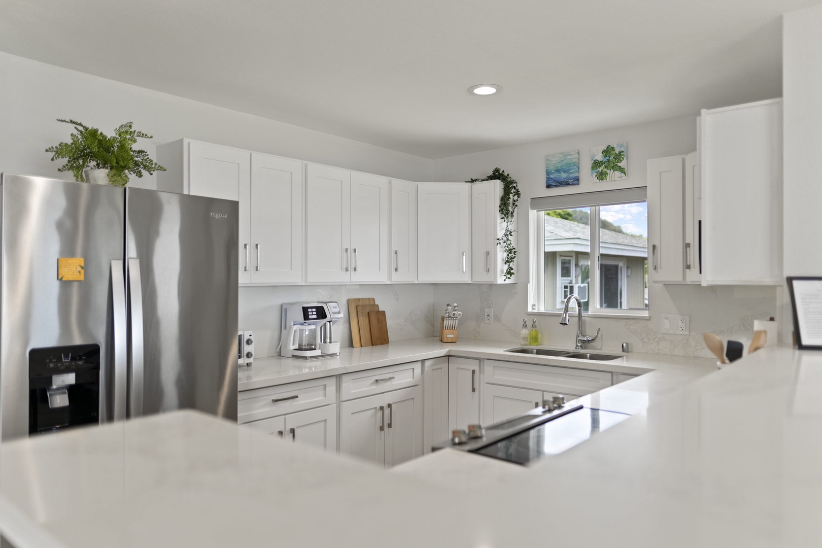 Haleiwa Vacation Rentals, Hale Nalu - The upstairs kitchen is updated and spacious with lots of natural light