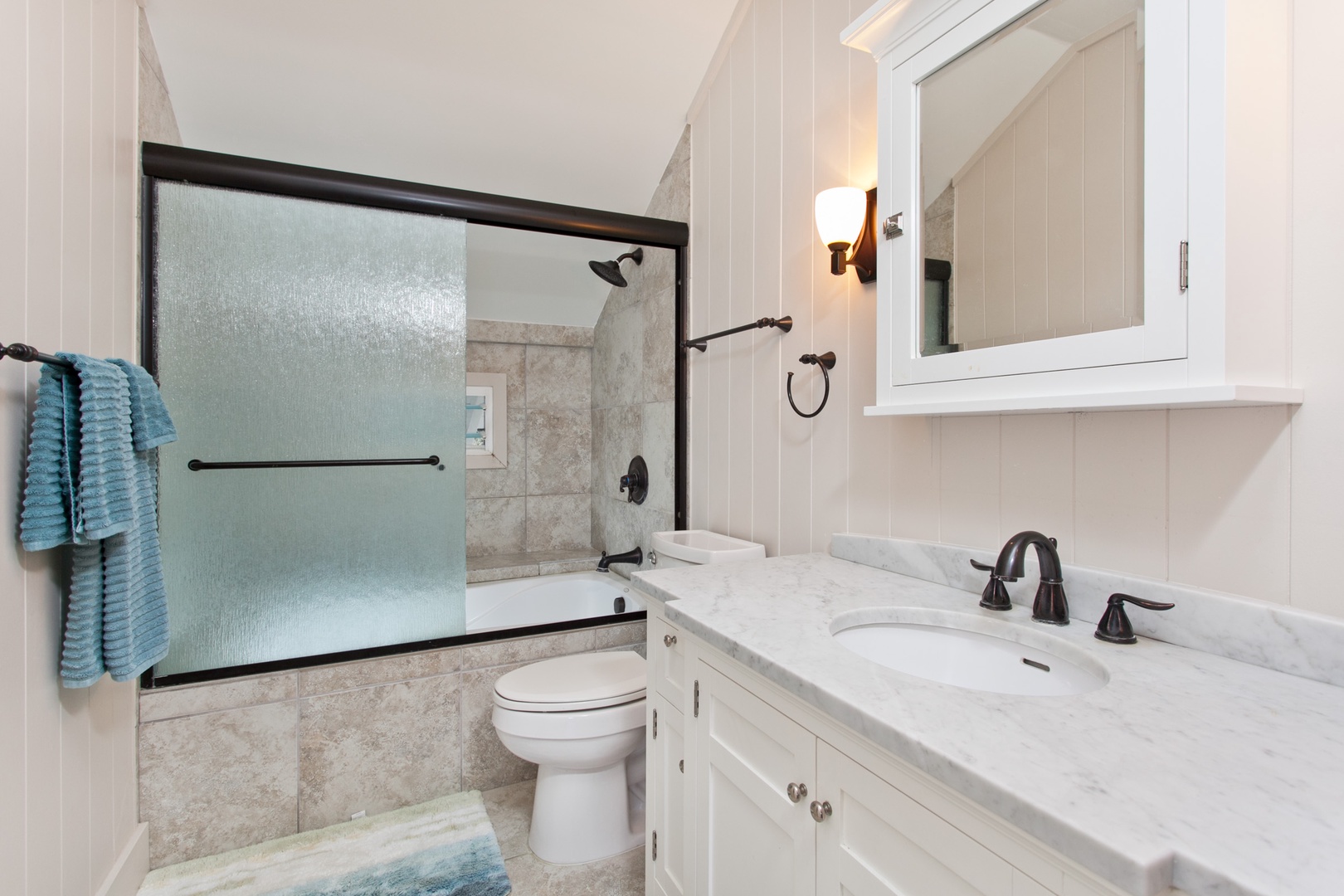 Kailua Vacation Rentals, Hale Mahina Lanikai* - Ensuite primary bathroom with a single vanity and a shower/tub combo.