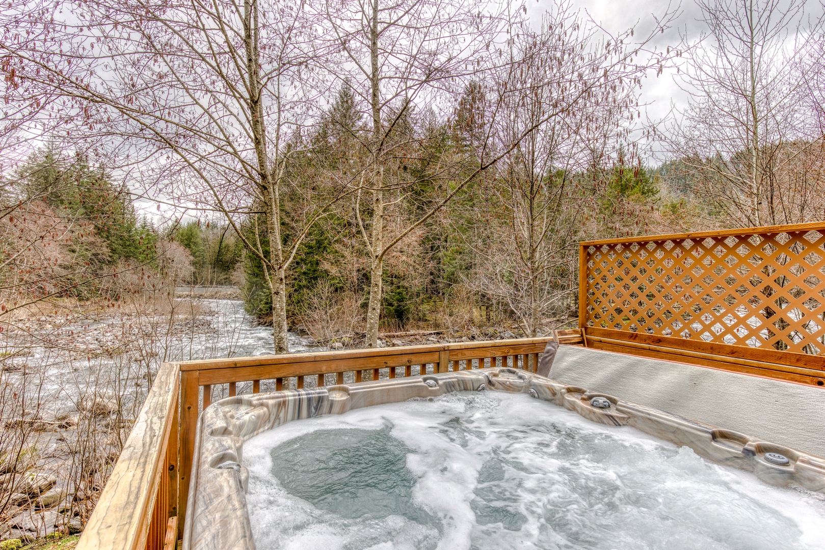 Rhododendron Vacation Rentals, Riverbend Cabin #2 - Soak in the hot tub while the river flows by