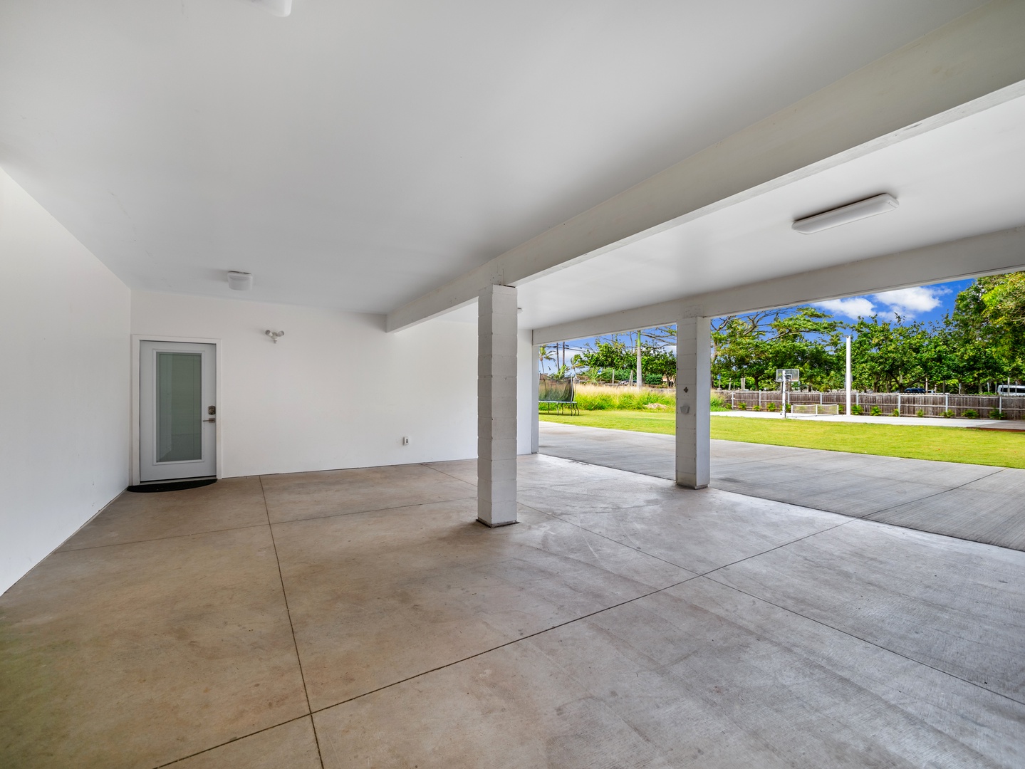 Haleiwa Vacation Rentals, Sunset Beach Island Retreat - The covered carport provides ample space for parking multiple vehicles, offering easy access to the home and plenty of room for storage or outdoor activities.