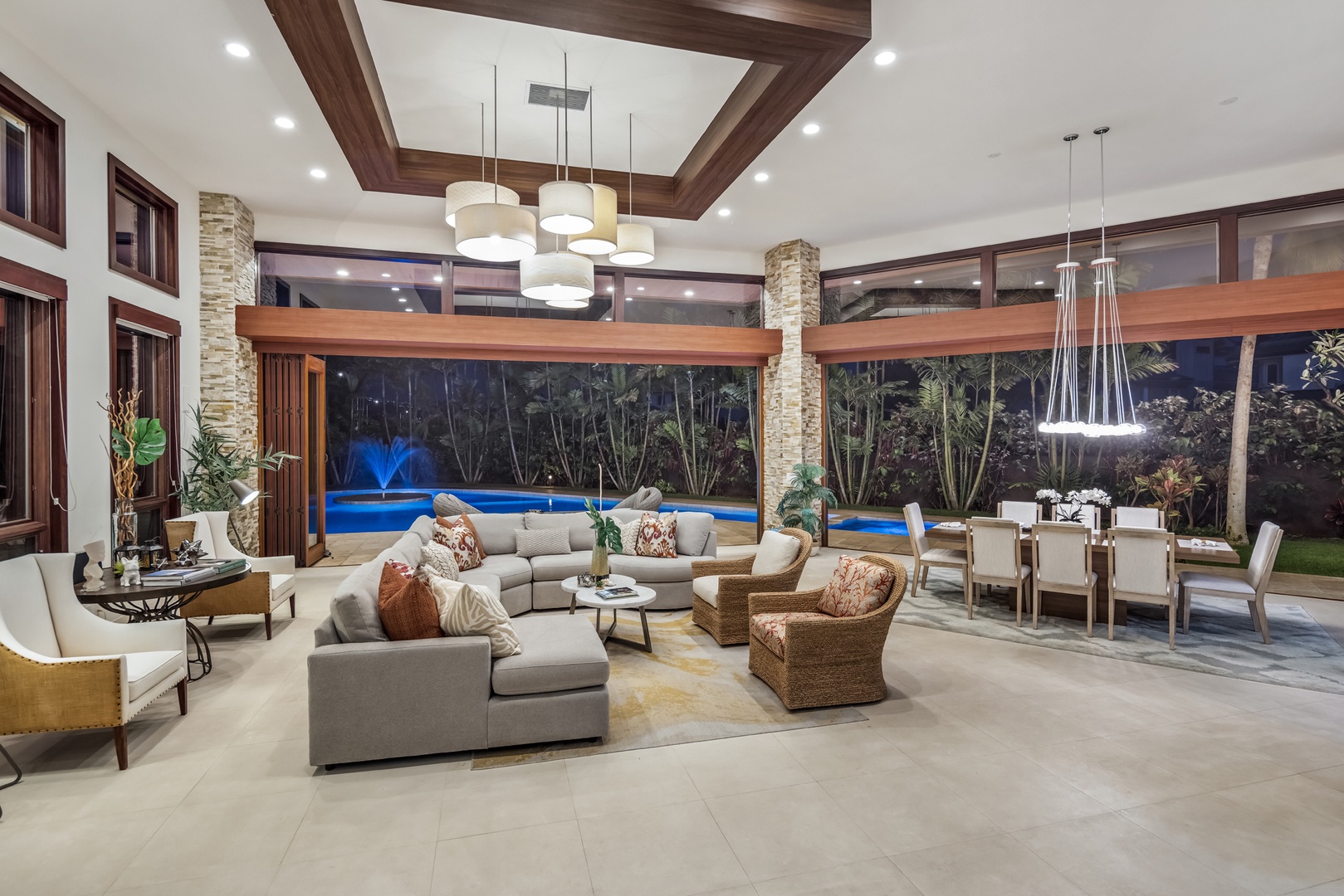 Honolulu Vacation Rentals, Kahala Grand Splendor - The beautifully designed living room seamlessly connects to the outdoor space for a true island retreat.