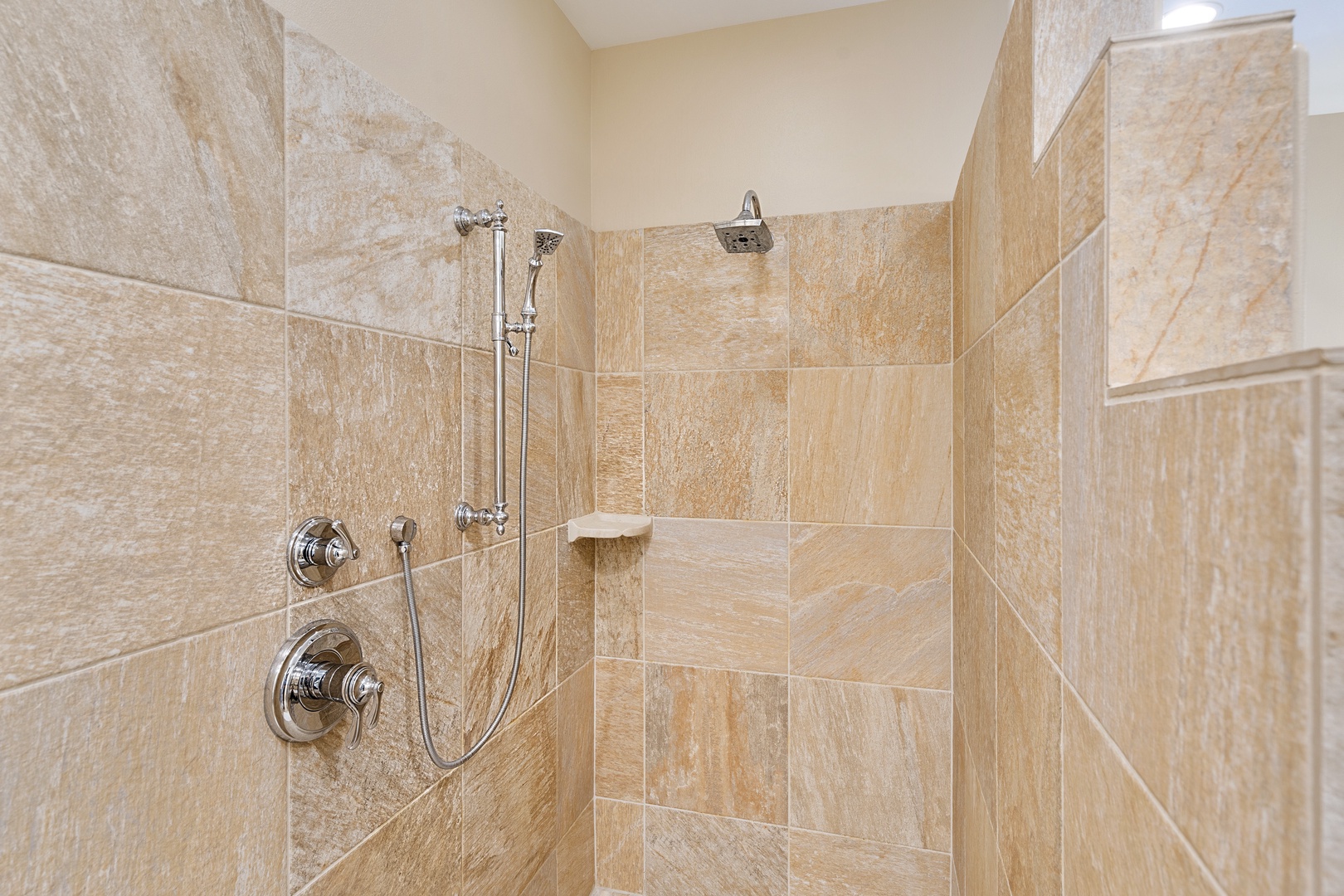 Kailua Kona Vacation Rentals, Kona Blue Vacations Holua Kai - Refresh in the luxurious walk-in shower of Kona Blue Vacations Holua Kai’s primary suite bathroom.