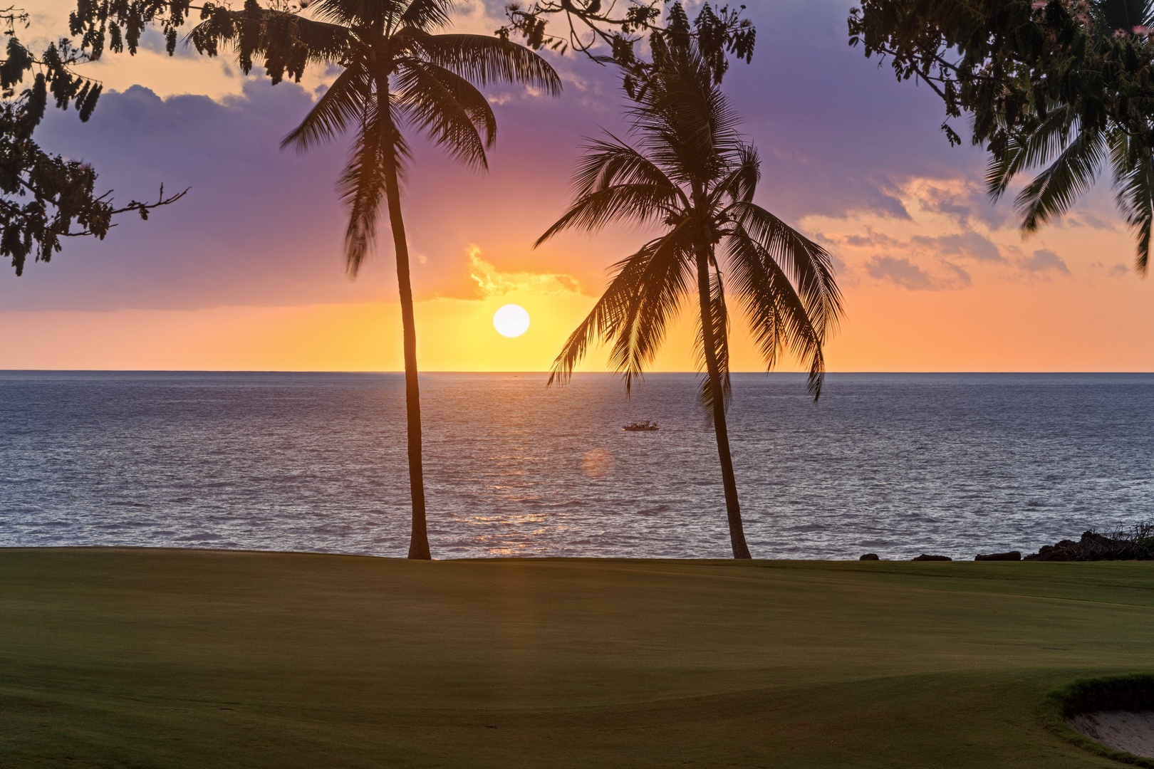 Kailua Kona Vacation Rentals, Holua Kai #27 - The sun drops into the Pacific behind the palms, the reason evenings run late here.