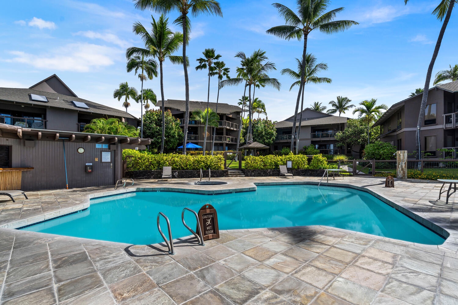 Kailua Kona Vacation Rentals, Kanaloa at Kona 3304 - One of three sparkling pools with ample sun loungers.