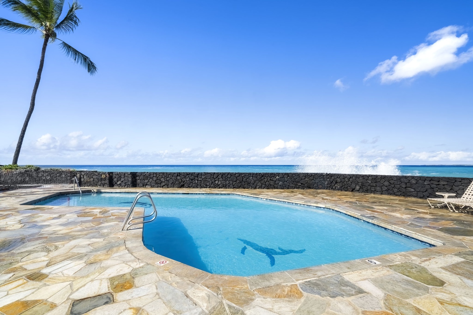Kailua Kona Vacation Rentals, Sea Village 1105 - Resort-style pool sits oceanside—perfect for sunbathing and cooling off with postcard-perfect views.
