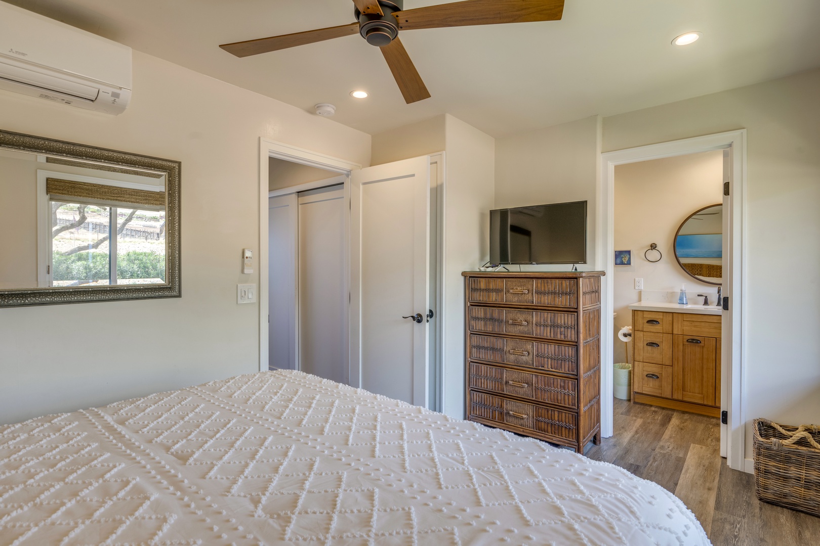 Lahaina Vacation Rentals, Puamana 240-3 - A cozy retreat featuring a plush queen size bed and elegant island-inspired décor.