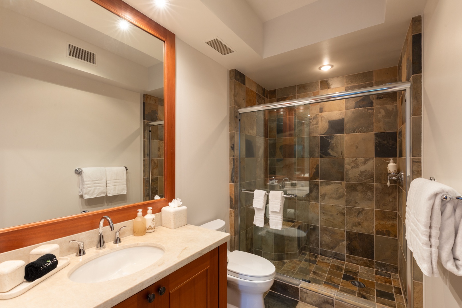 Kailua Kona Vacation Rentals, 3BD Waiulu Villa (111D) at Hualalai Resort - Step into your spa-like bathroom with luxurious marble counters, glass-enclosed shower, and fluffy towels awaiting your arrival.