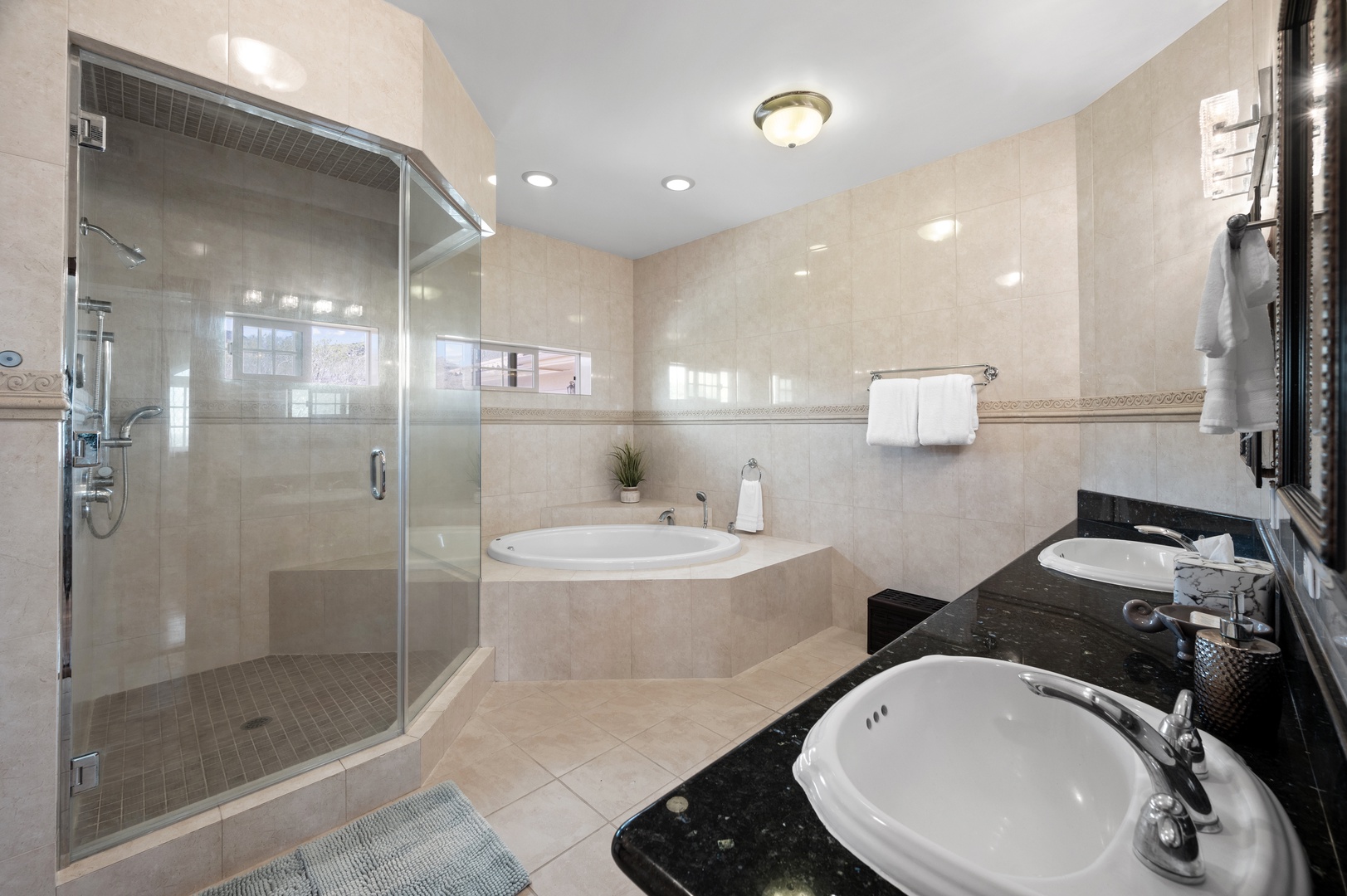 Honolulu Vacation Rentals, Lotus on a Hill* - The Primary Bedroom Ensuite is equipped with a dual vanity, walk-in shower, and spa-like soaking tub
