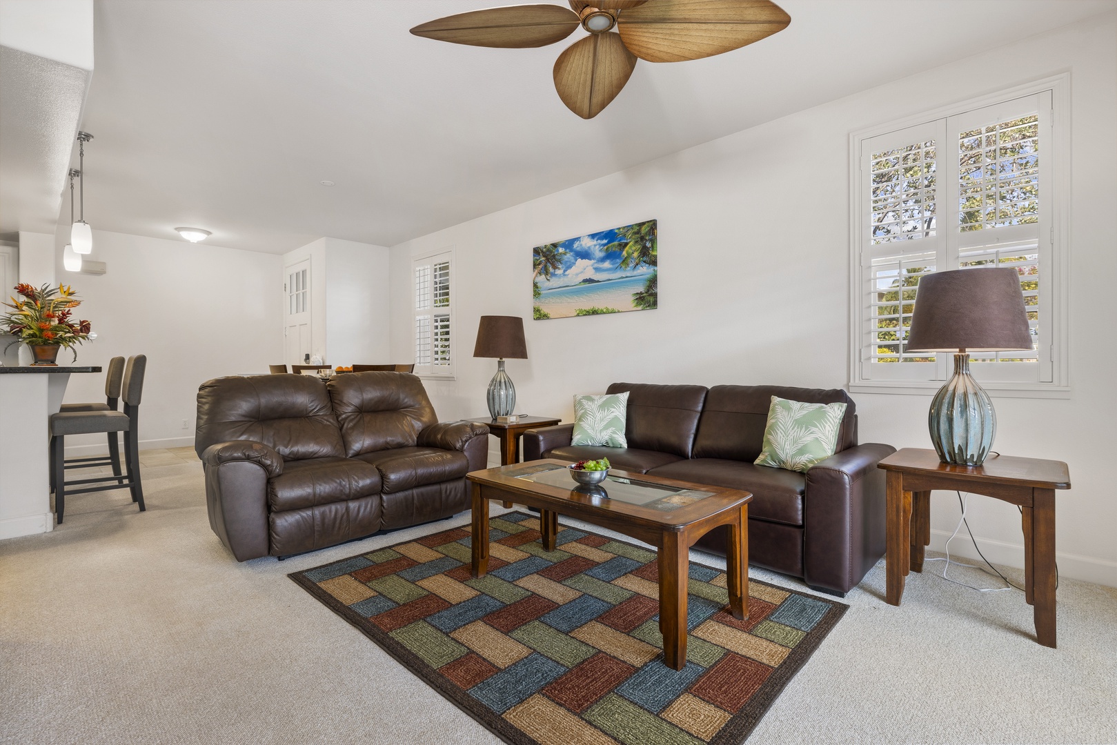 Gather with family and friends in the bright, open-concept living space designed for easy island living.