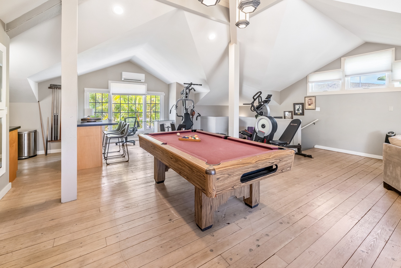 Honolulu Vacation Rentals, Moana Lani - Guest Cottage with pool table, fitness equipment, and open loft-style living.