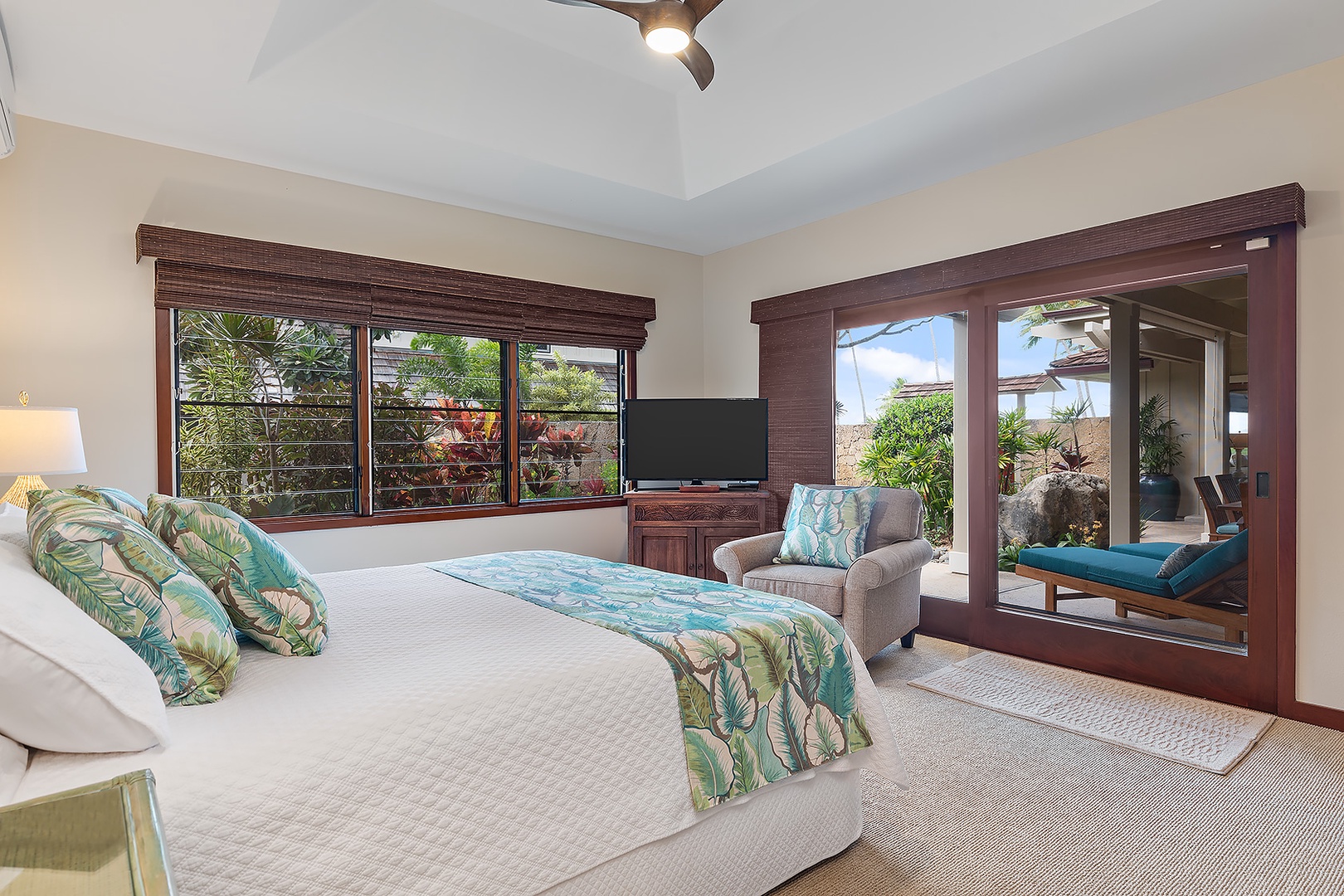 Kailua Vacation Rentals, Kailua Shores Estate 5 Bedroom - Beach house spacious guest bedroom with a king-size bed, cozy seating, and garden vistas.