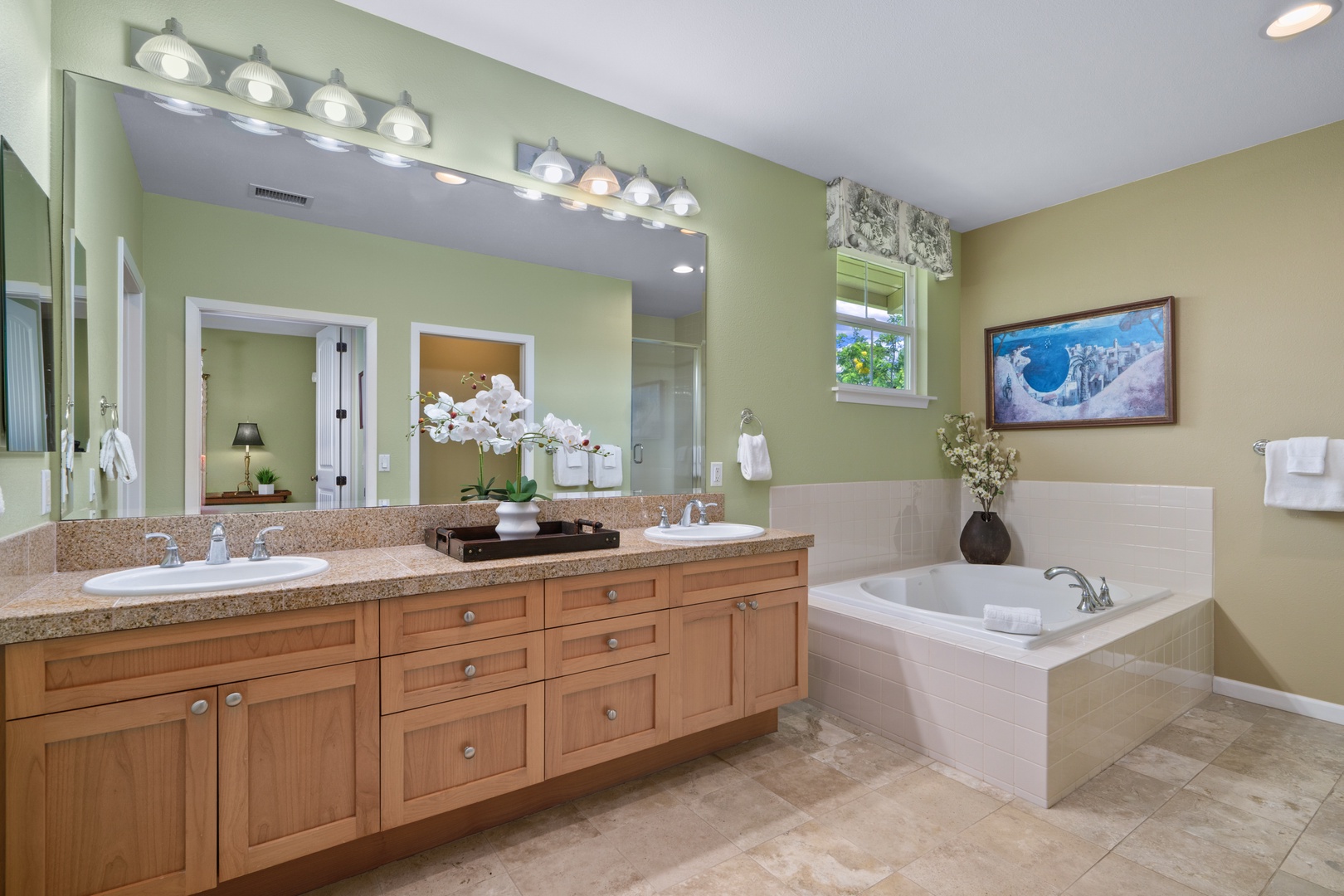 Princeville Vacation Rentals, Kaimana Villa - Unwind in your spa-like bathroom with dual vanities, granite counters, and a relaxing soaking tub perfect for evening bubble baths.