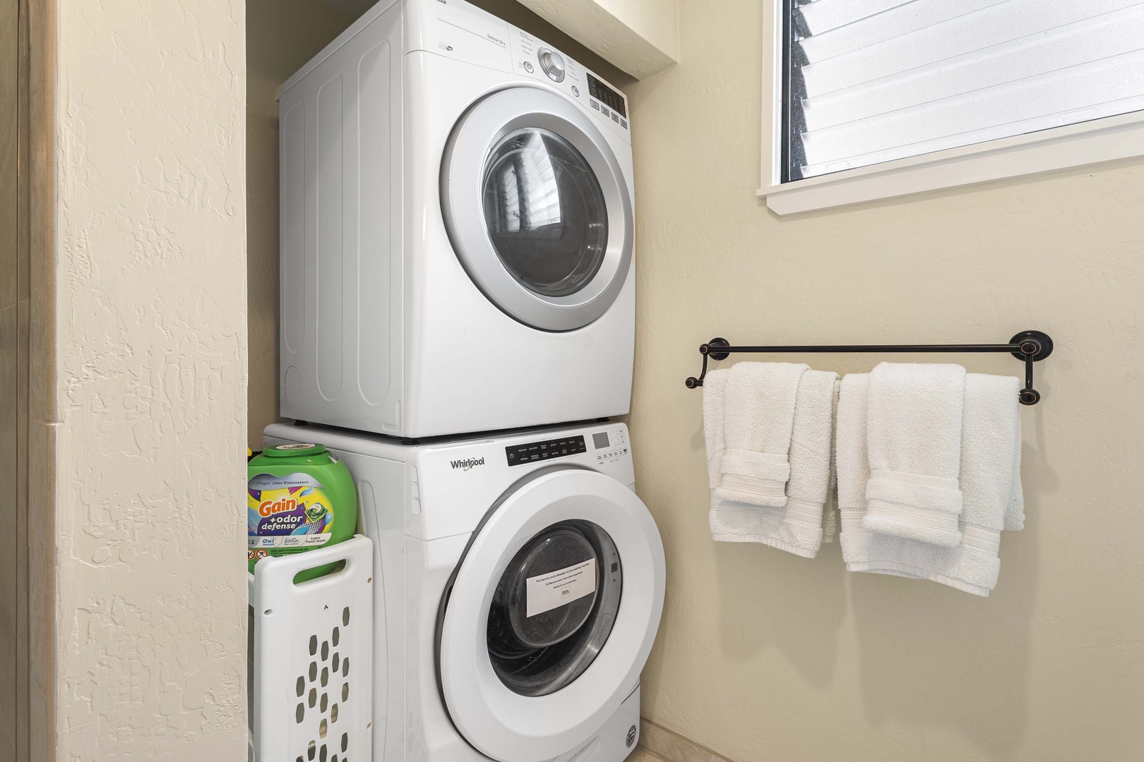 Kailua Kona Vacation Rentals, Keauhou Kona Surf & Racquet 2101 - Washer/dryer conveniently at the primary suite bathroom.