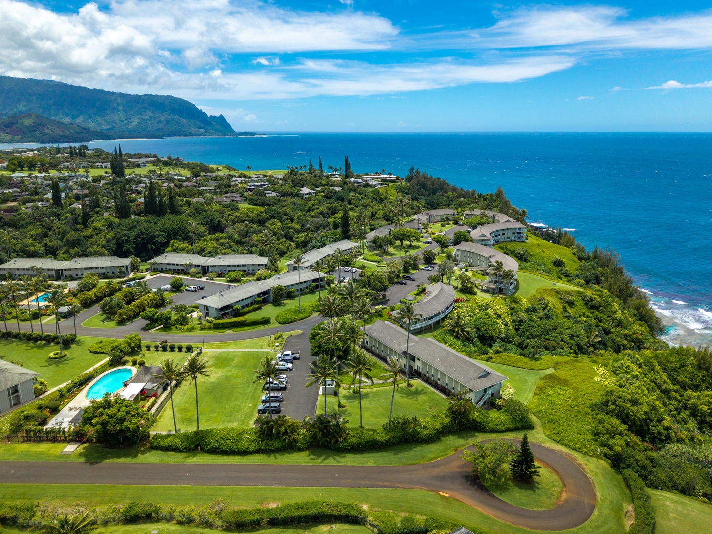 Princeville Vacation Rentals, Alii Kai 7201 - Green cliffs and open ocean stretch along Kauai's north shore.