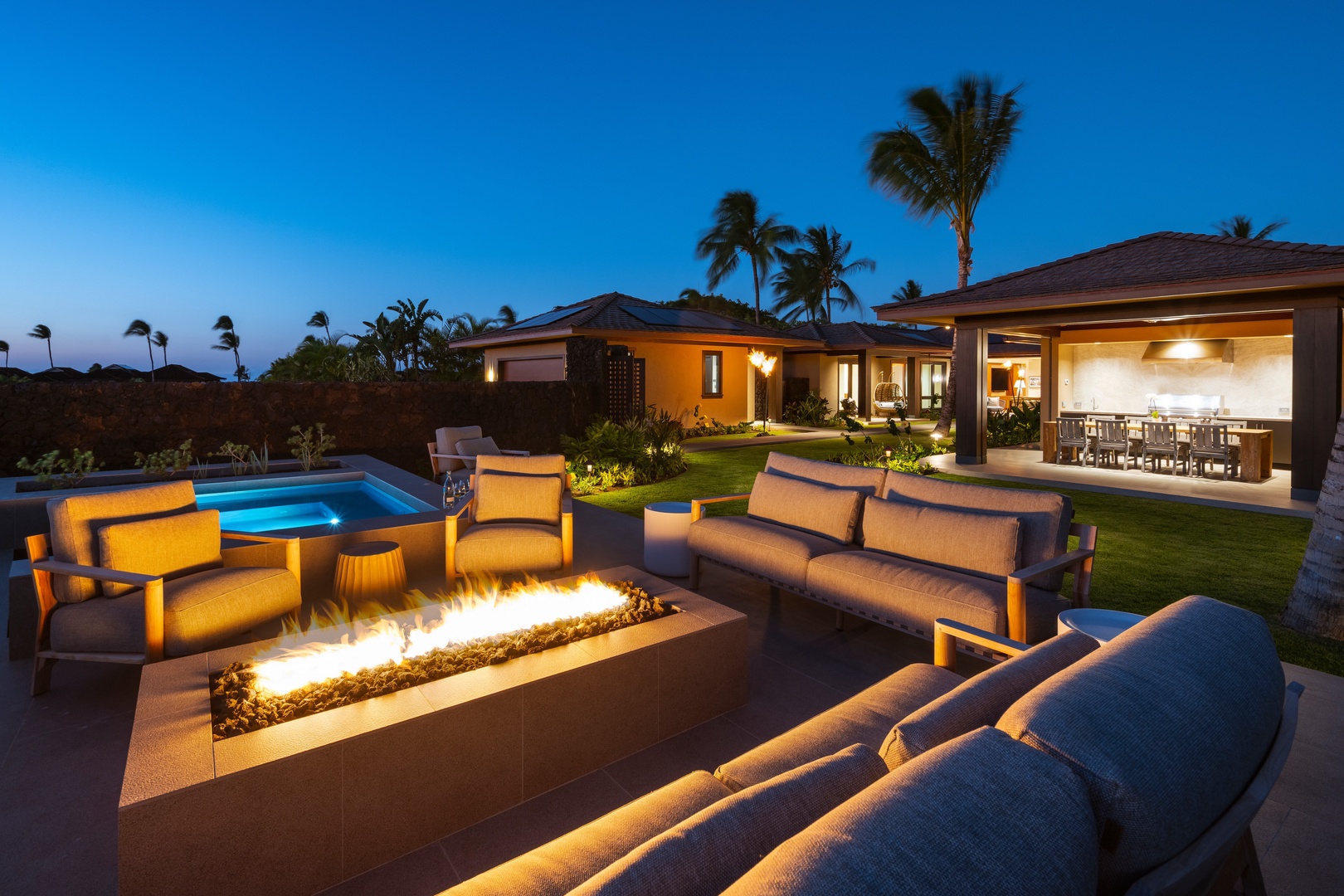 Kailua-Kona Vacation Rentals, 4BD Ka'Ulu Estate (102A) at Hualalai Resort - Modern private residence with outdoor fire pit, spa, and palm-lined setting creating the perfect Hawaiian retreat experience.