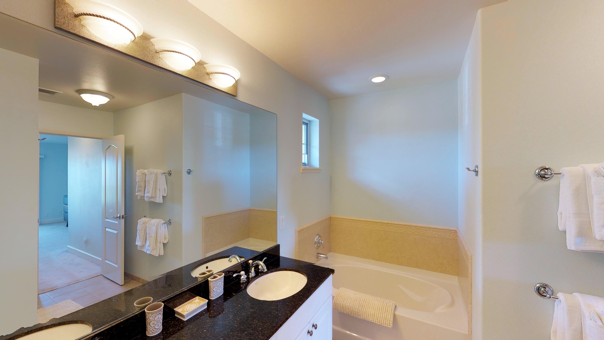 Kapolei Vacation Rentals, Ko Olina Kai 1035D - The primary guest bathroom with a soaking tub and ample lighting.