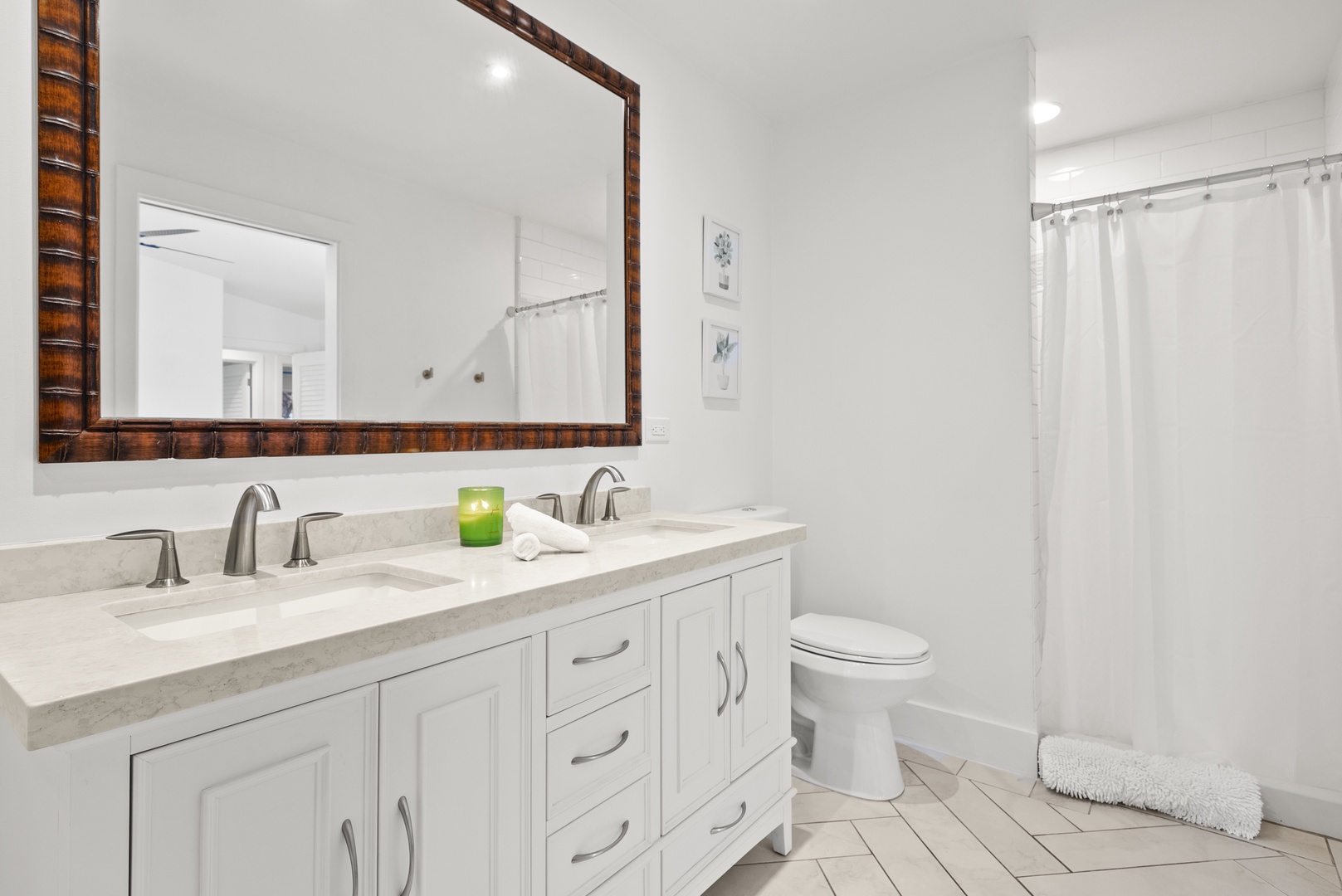 Kaaawa Vacation Rentals, Ka'a'awa Hale - Bright bathroom with double sinks, ample storage, and a modern, clean design.