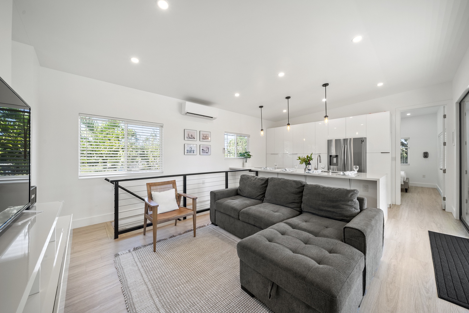 Haleiwa Vacation Rentals, Sunset Beach Island Retreat - The bright and airy living space is perfect for unwinding, with a cozy sectional sofa that invites you to relax after a day of exploring