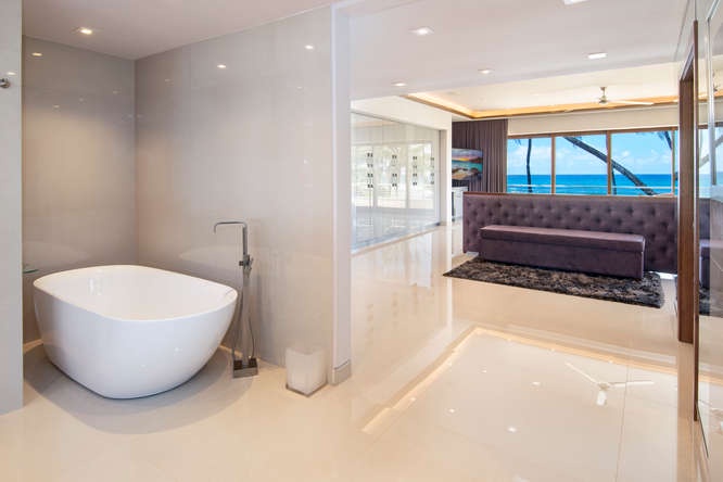 Honolulu Vacation Rentals, Diamond Head Beachfront Estate - Spa-inspired primary bath with soaking tub, walk-in shower, and luxury finishes.