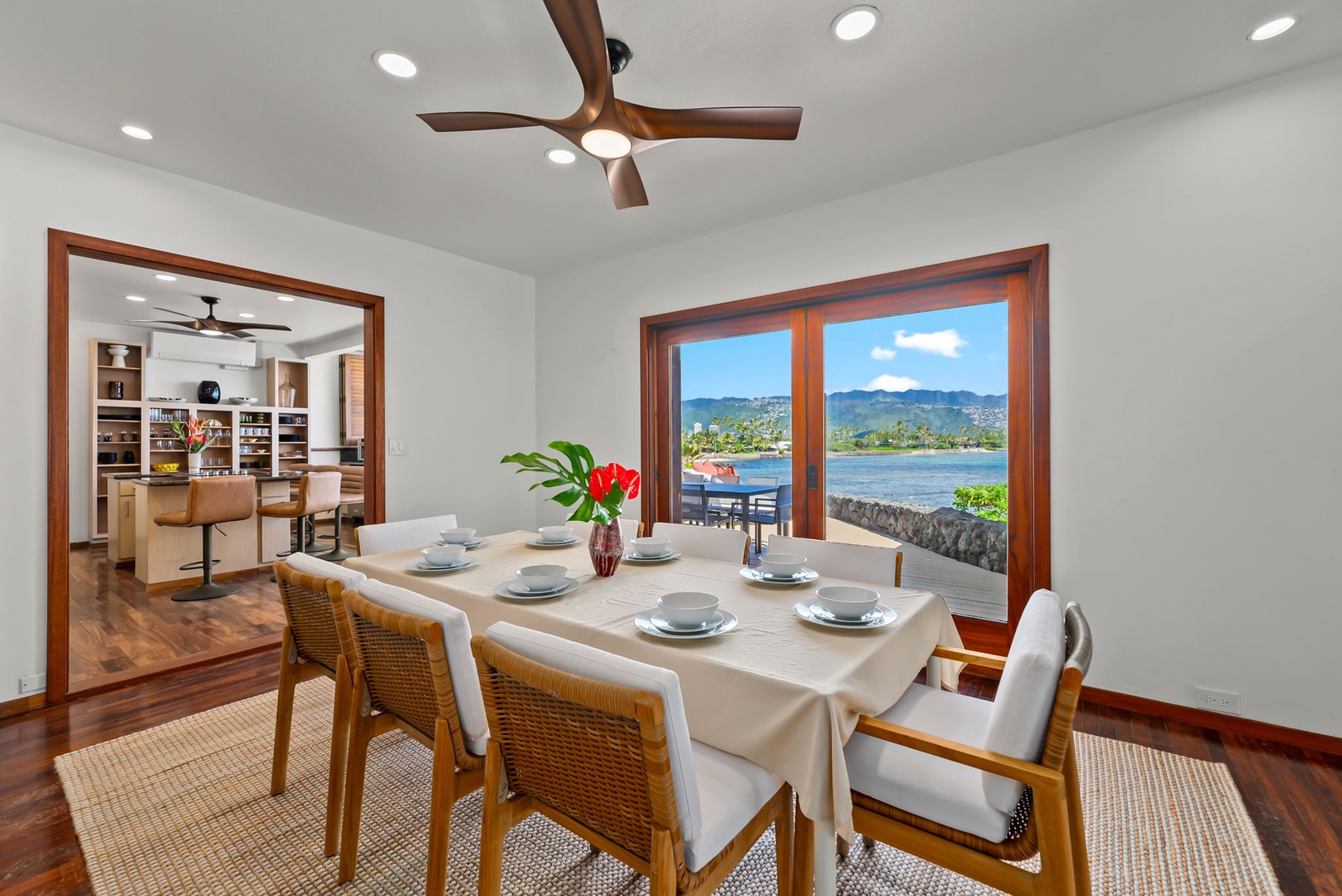 Honolulu Vacation Rentals, Black Point Ocean Villa - Elegant dining table where every meal becomes a celebration, with stunning ocean views framing your unforgettable moments together.