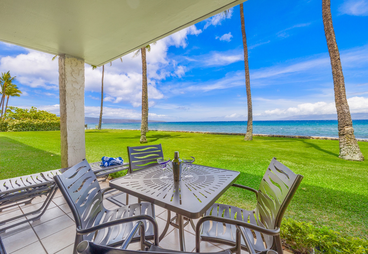 Lahaina Vacation Rentals, Papakea L-106 - Savor breathtaking ocean views while enjoying a meal on this lanai, a perfect spot to unwind and soak in the island’s beauty.