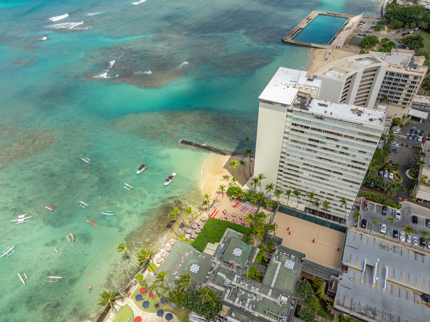 Honolulu Vacation Rentals, Colony Surf Getaway - Bird’s-eye view of the coastline, featuring crystal-clear waters and beachfront properties.