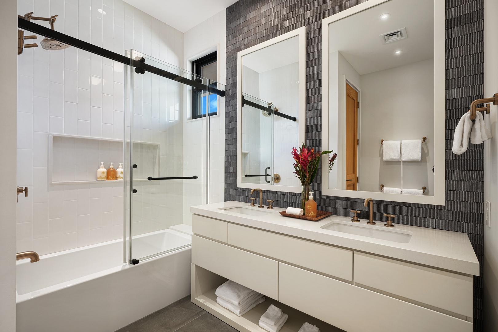 Koloa Vacation Rentals, Hale Ka Pua Ola at Kukuiula - Sleek bathroom with modern fixtures, dual vanities, and a glass-enclosed shower.