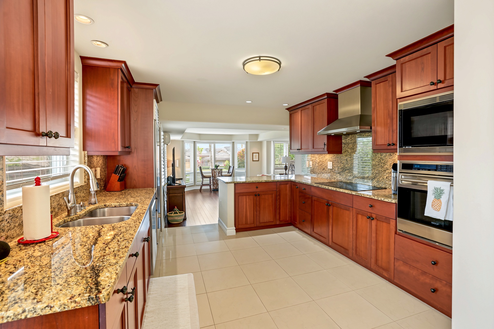 Princeville Vacation Rentals, Hale Hau'oli Moku - The wall oven, built-in microwave, and long granite countertops make sure dinner in never feels cramped.