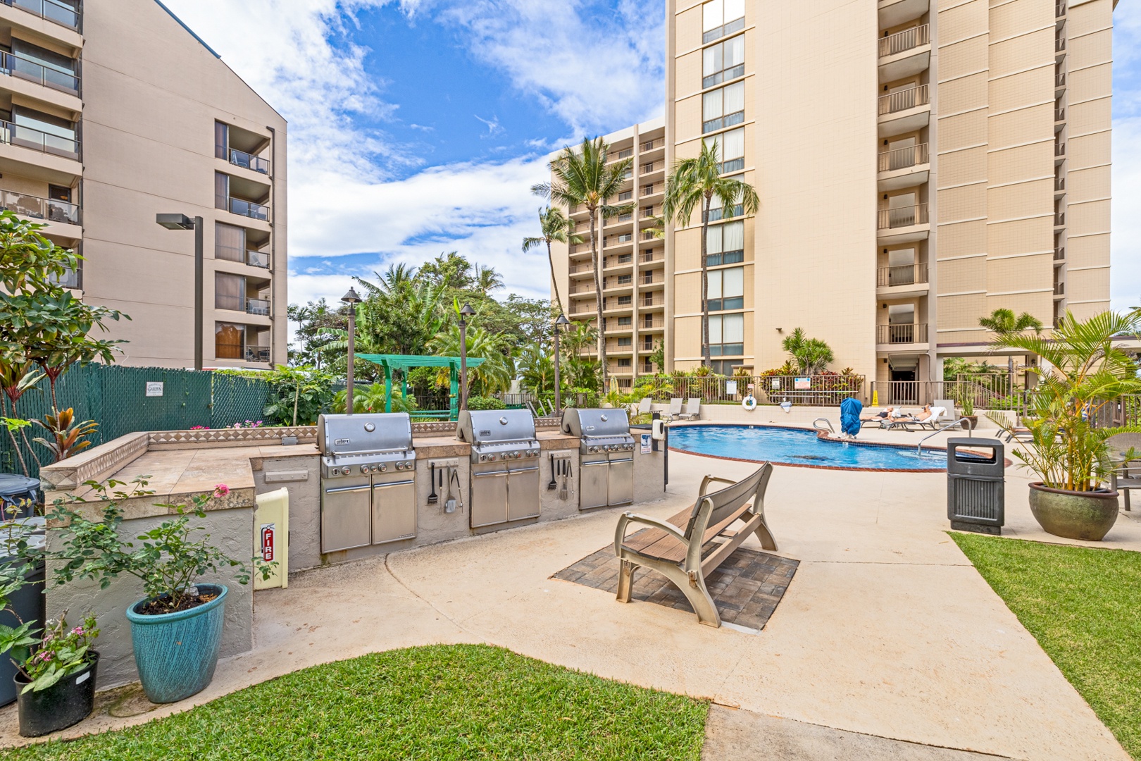 Lahaina Vacation Rentals, Valley Isle 804 - Enjoy a perfect outdoor gathering at the communal BBQ area, just steps away from the pool, where you can grill your favorite meals and relax in the tropical surroundings.