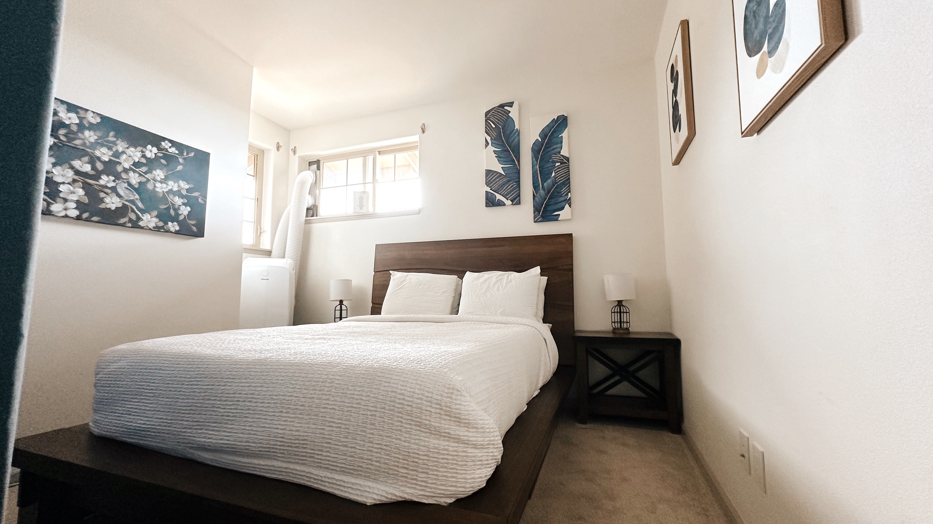 Makaha Valley Vacation Rentals, Makaha Valley Hale Kai** - Light-filled bedroom with queen bed, offering a calm space to unwind.
