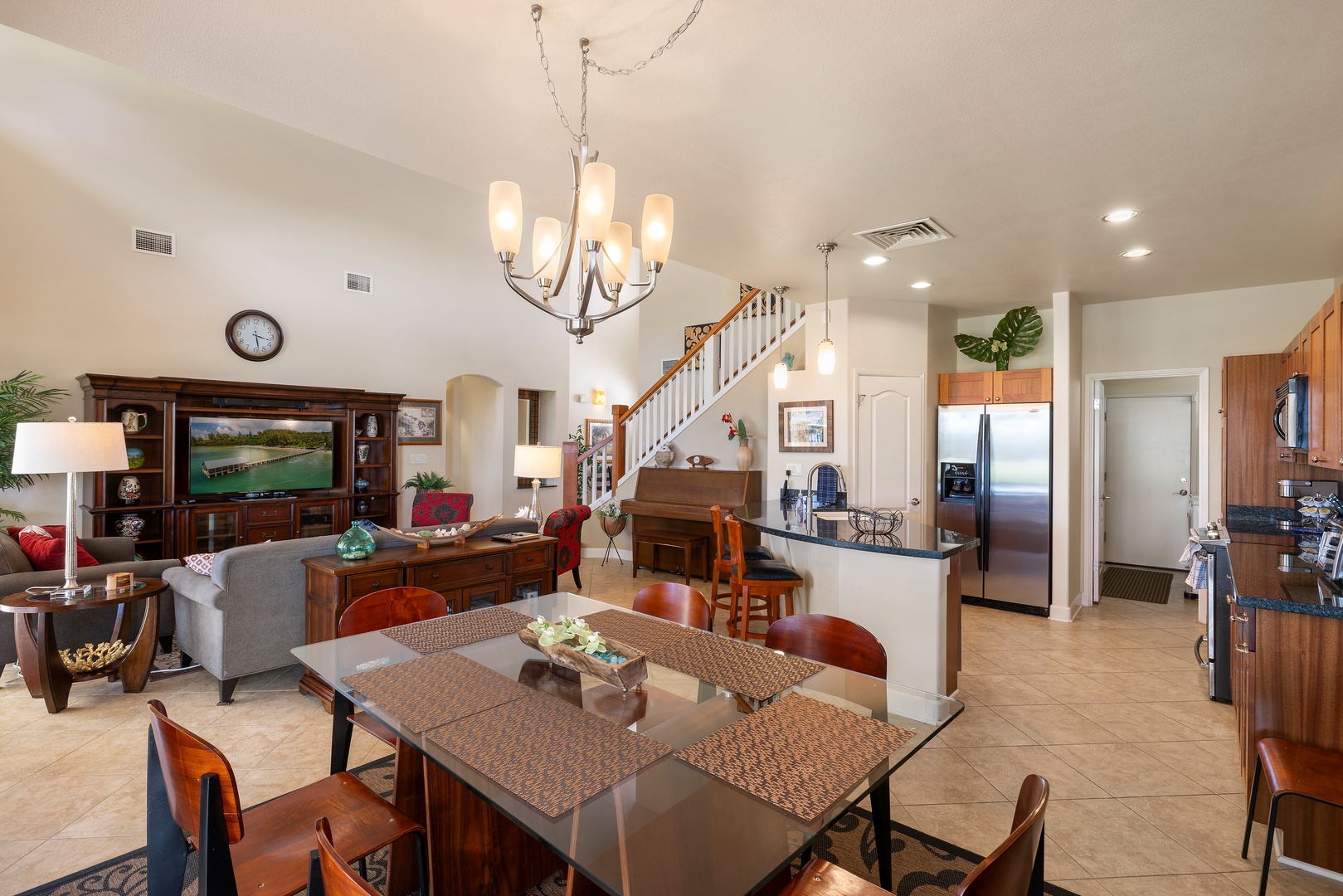 Gather around your spacious dining table while the chef prepares meals in your fully-equipped kitchen, with cozy living areas perfect for relaxing together.