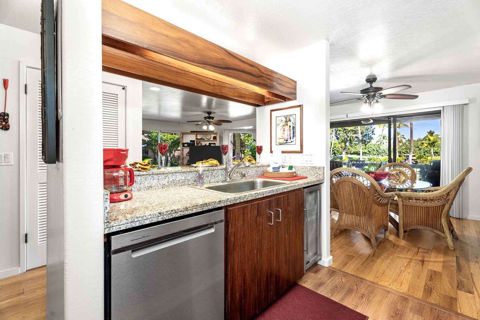 Kailua Kona Vacation Rentals, Kanaloa at Kona 701 - Prepare your favorite meals in this fully equipped kitchen featuring granite counters, stainless appliances, and warm wood finishes.
