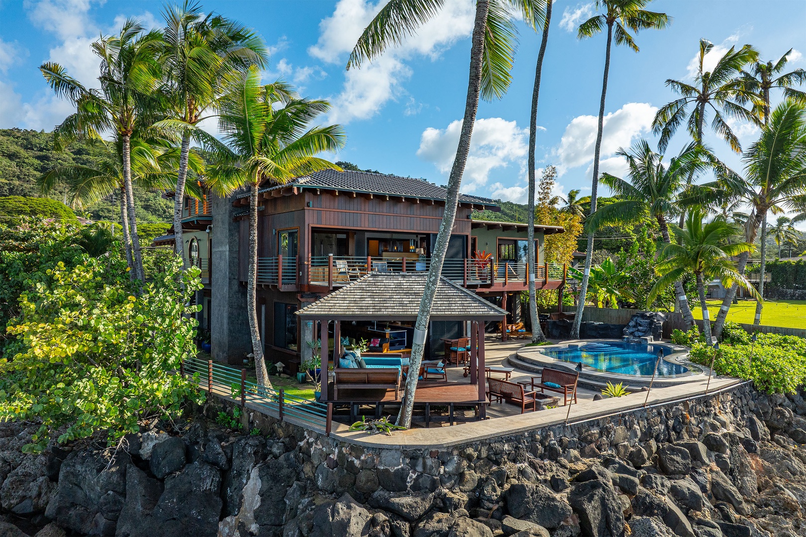 Haleiwa Vacation Rentals, Samurai House - Exterior view of the estate perched on dramatic lava rock cliffs.