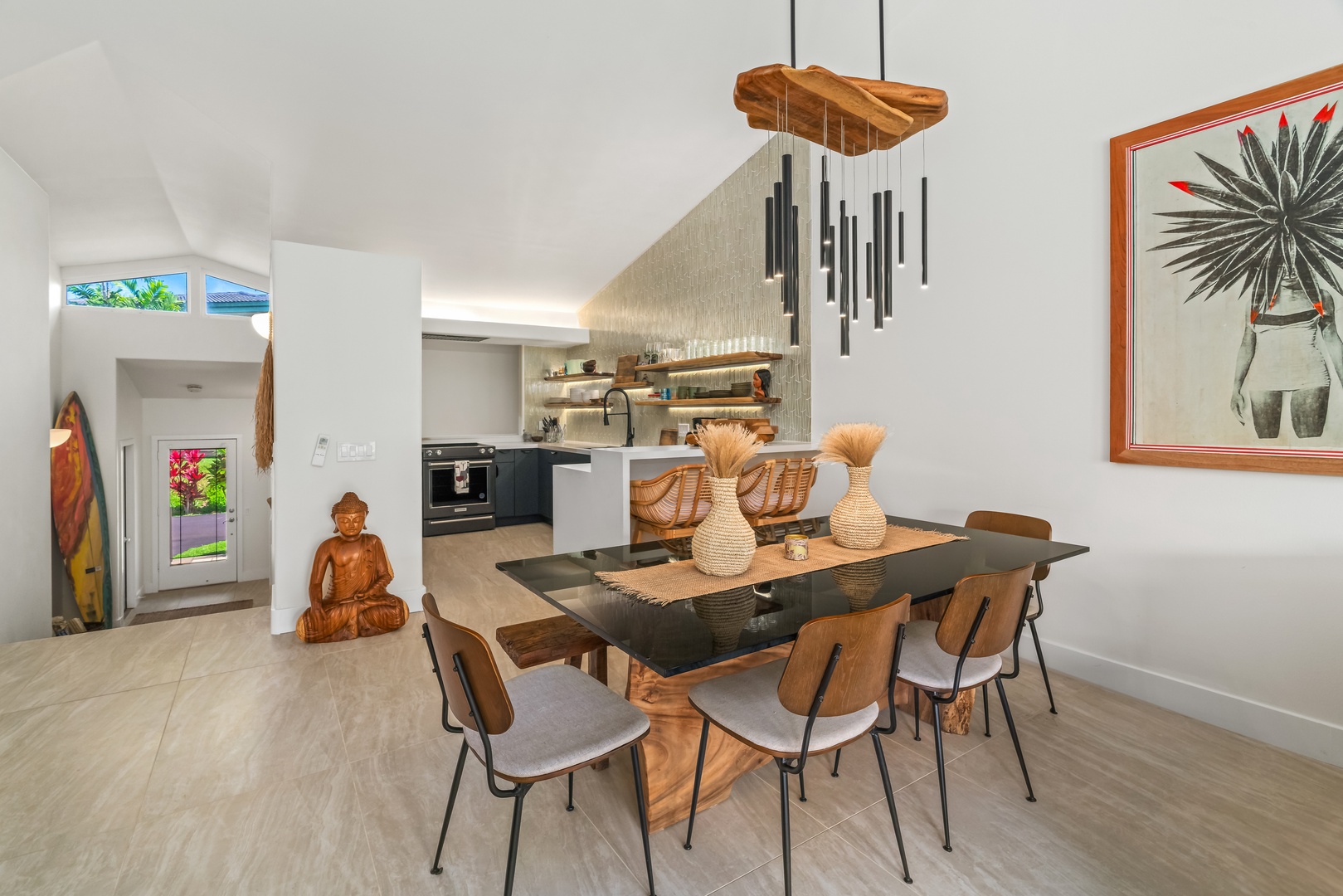 Princeville Vacation Rentals, Mana Wahine - Gather around this handcrafted dining table under sculptural pendant lights.