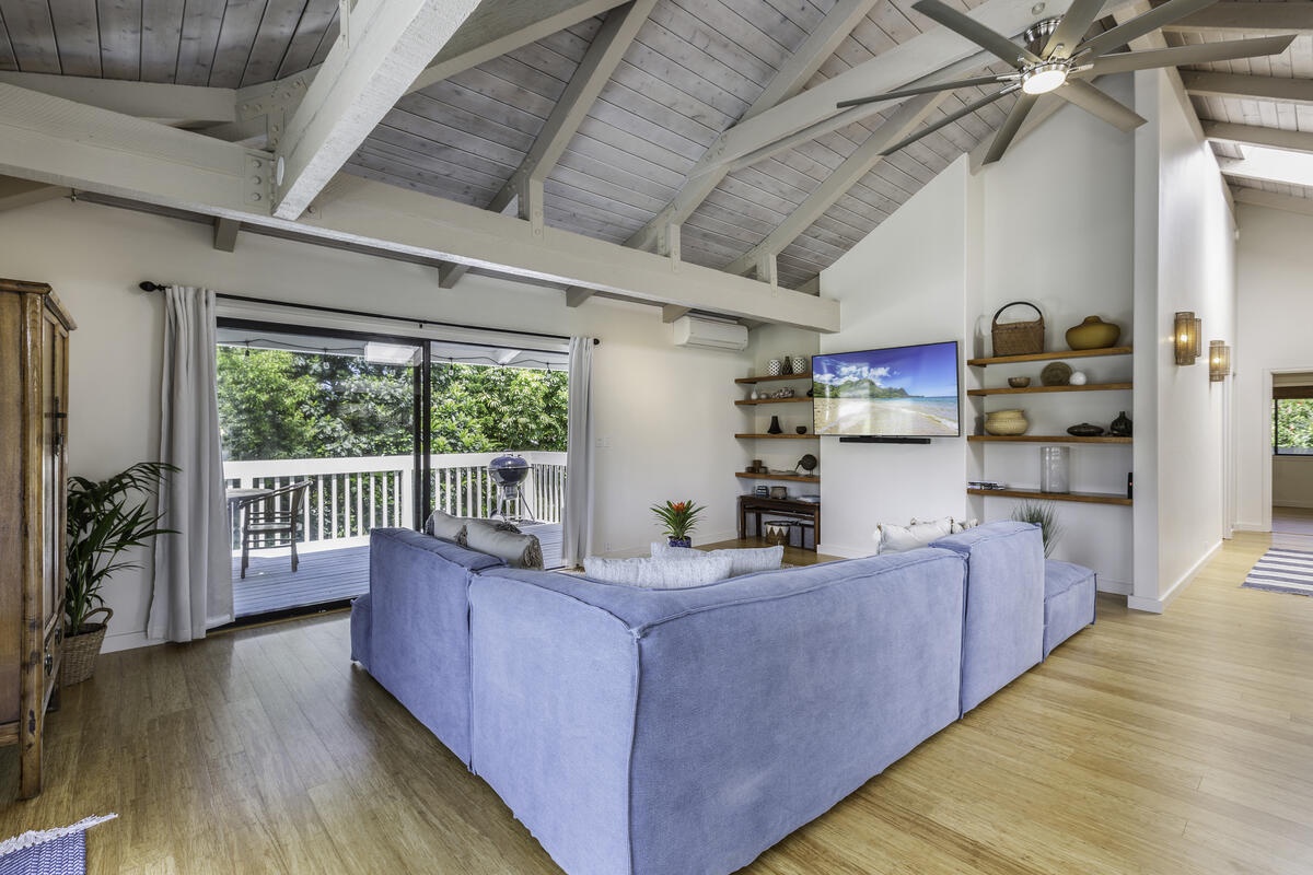 Princeville Vacation Rentals, Hale Kalani - The comfortable seating invites you to unwind, whether you're curling up with a good book or tuning into the large flat-screen TV