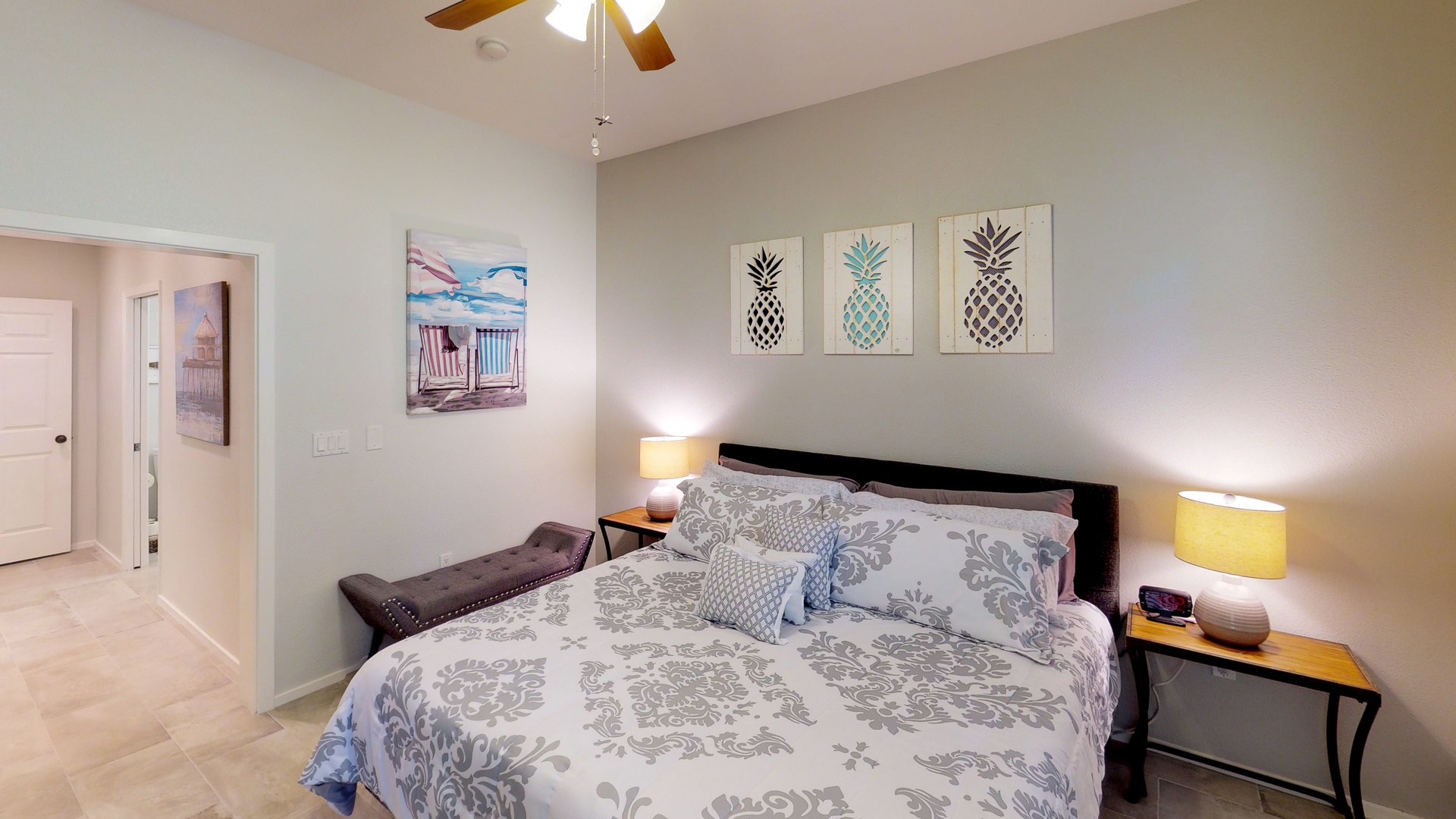 Kapolei Vacation Rentals, Coconut Plantation 1222-3 - The primary guest bedroom with bench seating and luxurious linens.