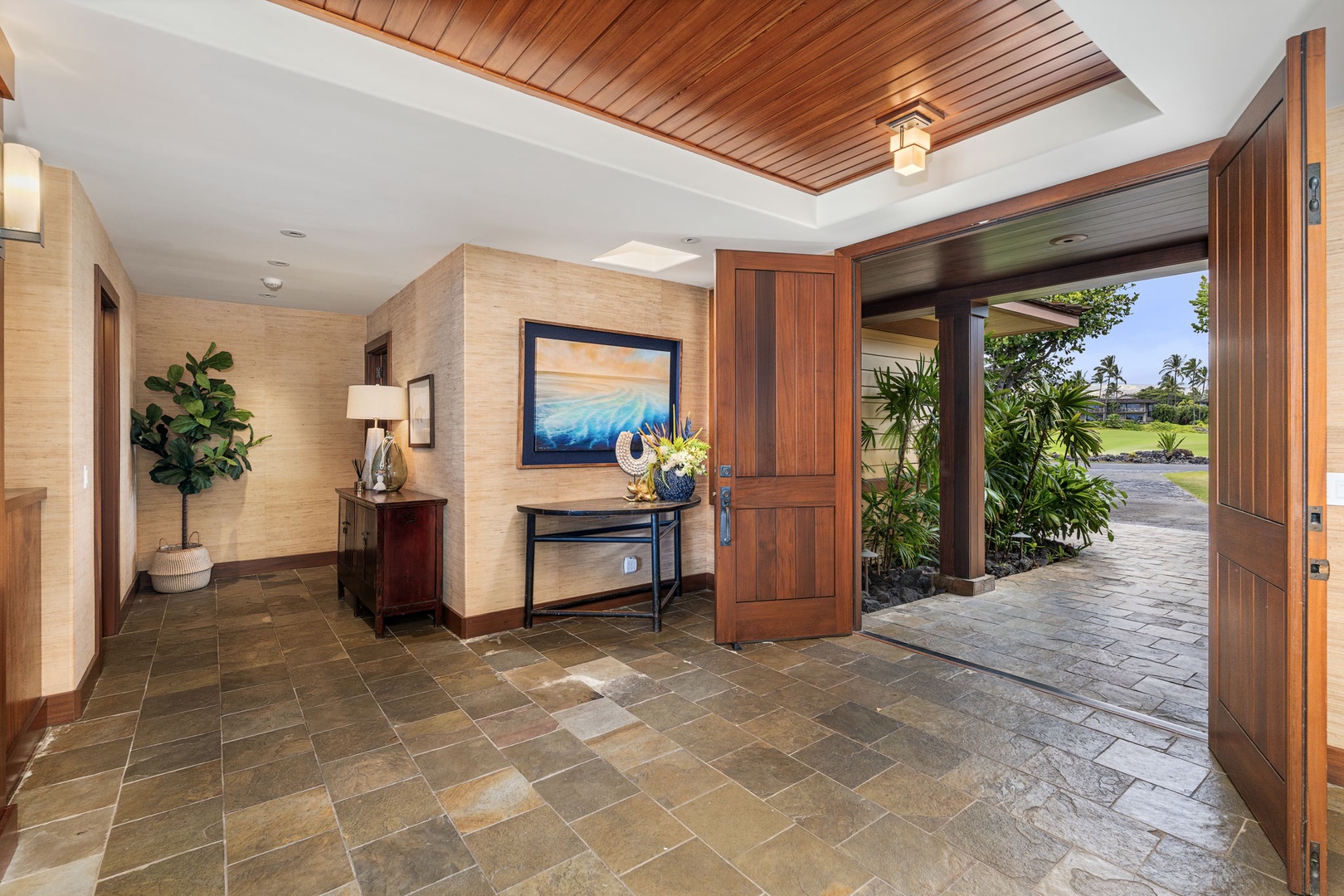 Kailua Kona Vacation Rentals, 3BD Pakui Street Estate (149) at Hualalai Resort - The entry sets the tone: koa overhead, stone underfoot, the green already in view.