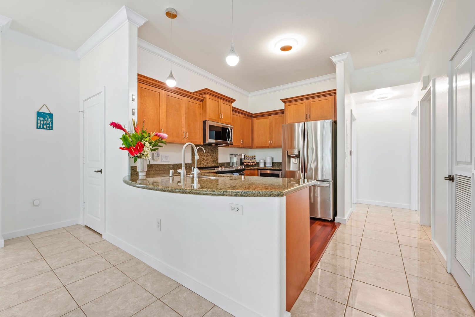 Kapolei Vacation Rentals, Kai Lani Luxury 6D - Modern kitchen with a granite countertop and stainless steel appliances, perfect for preparing island-inspired dishes.