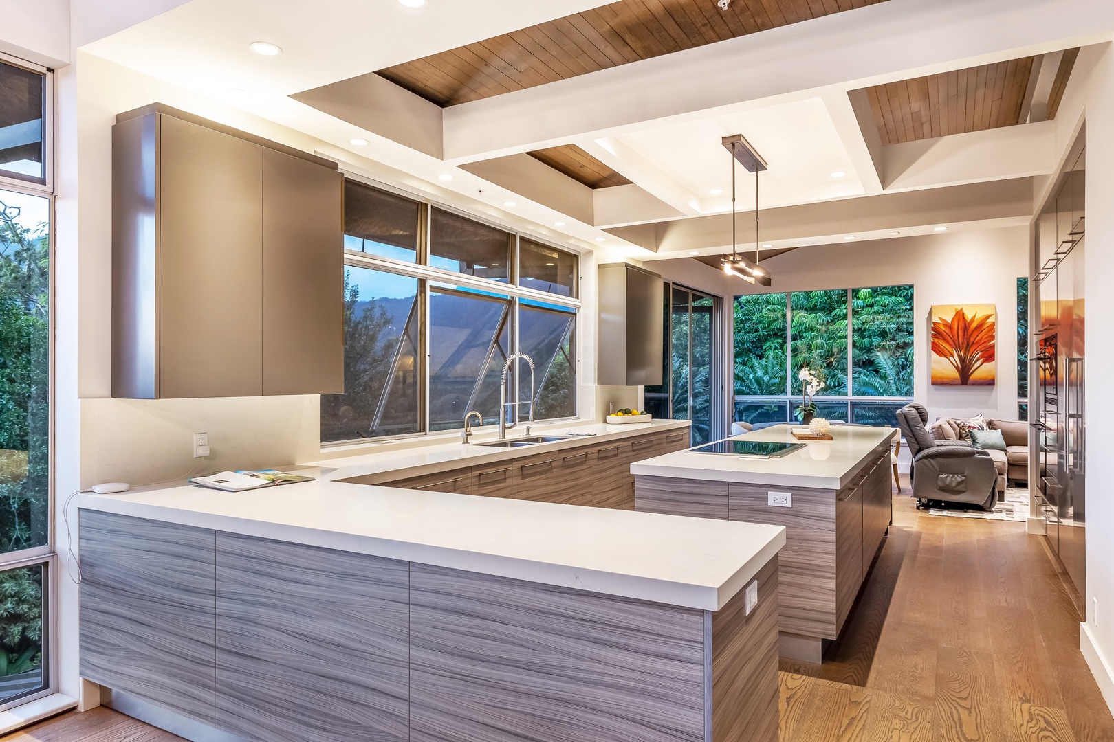 Honolulu Vacation Rentals, Manoa Royal Retreat - Chef-style kitchen with massive island, integrated storage, and wraparound nature views.