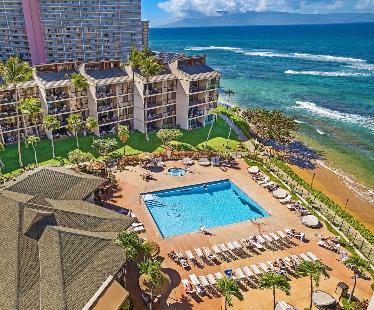 Lahaina Vacation Rentals, Kaanapali Shores 903 - Relax on the lanai with a view of the resort pool, the perfect spot to enjoy a morning coffee or an evening drink.