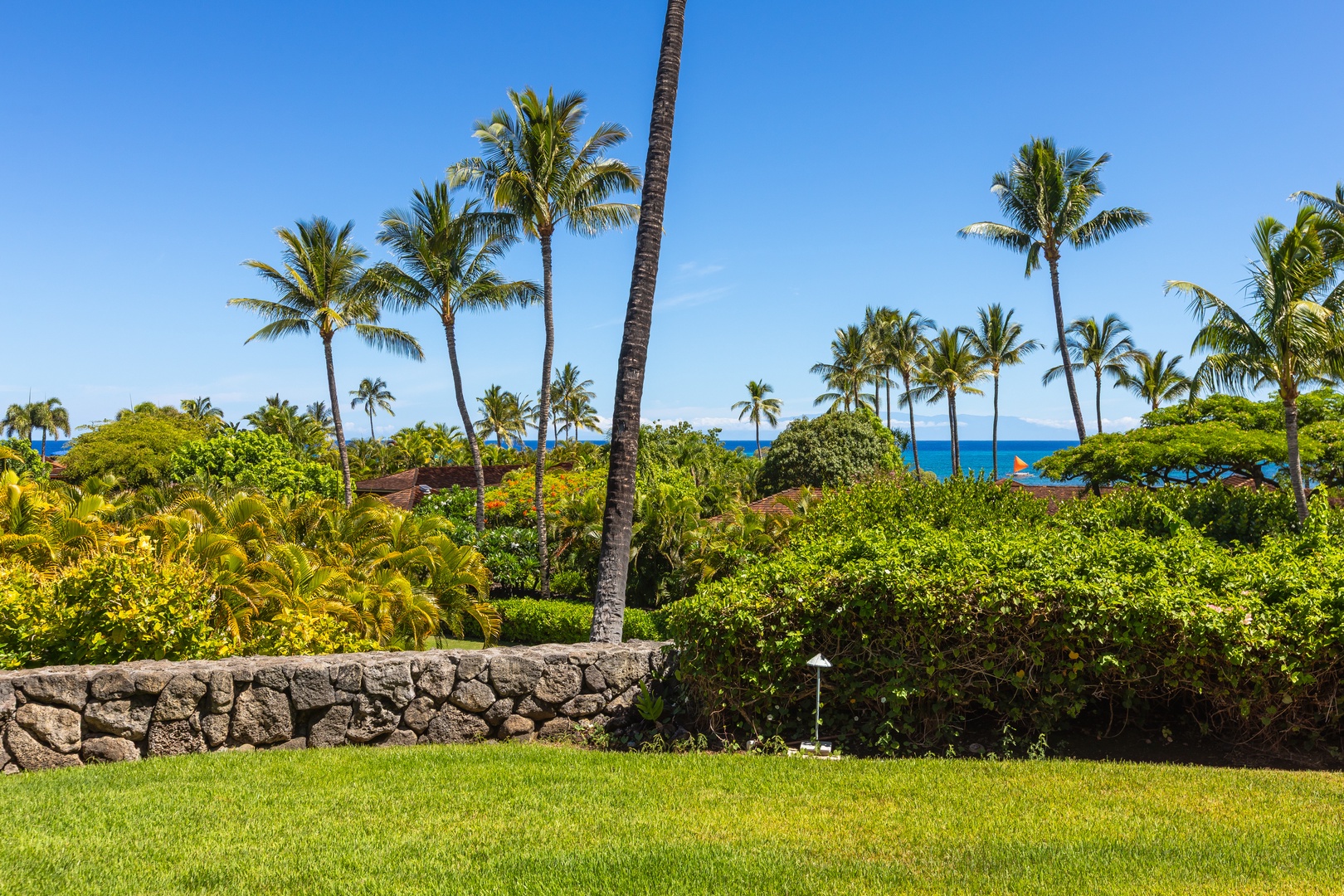 Kailua Kona Vacation Rentals, 2BD Hillside Villa (4102) at Hualalai Resort - Vibrant tropical gardens with glimpses of the Pacific beyond.